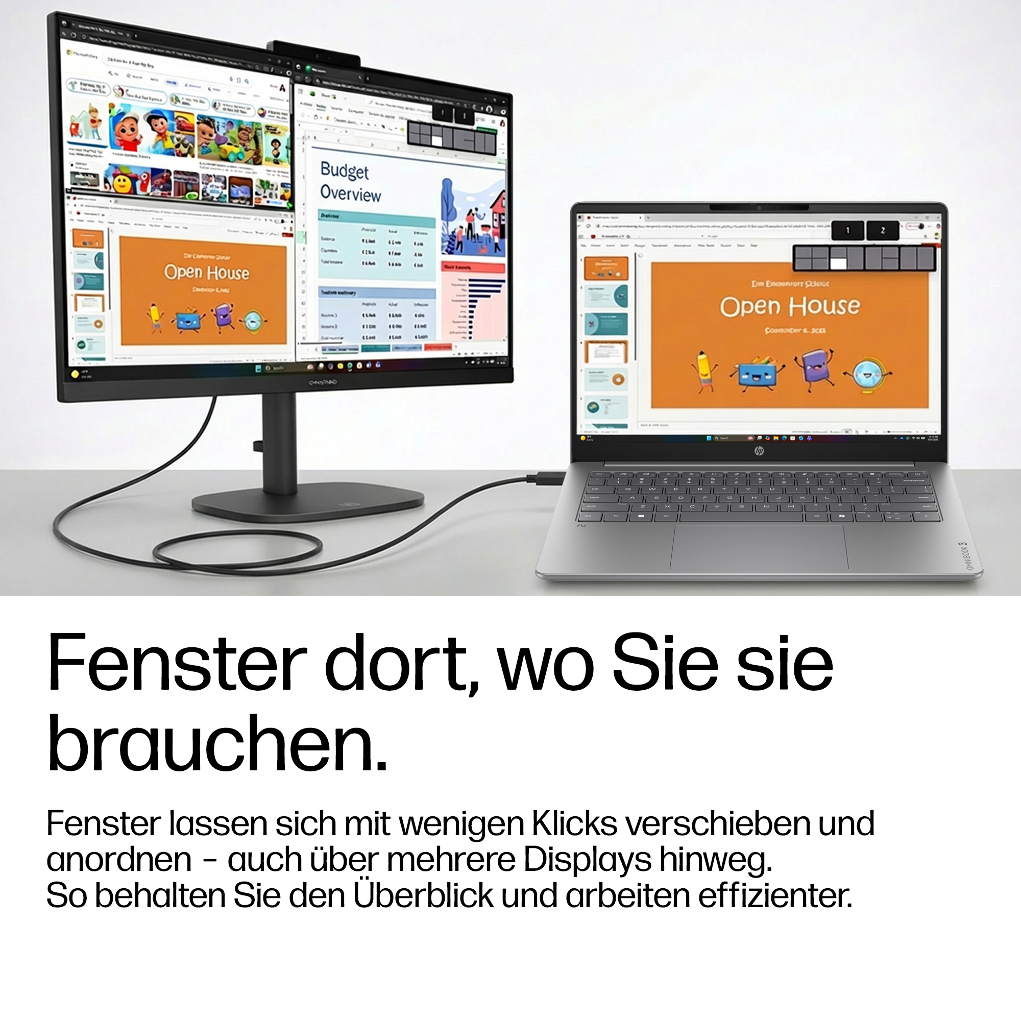 Ein Laptop verbunden mit einem großen Monitor zeigt eine offene Präsentation auf grauem Tisch.