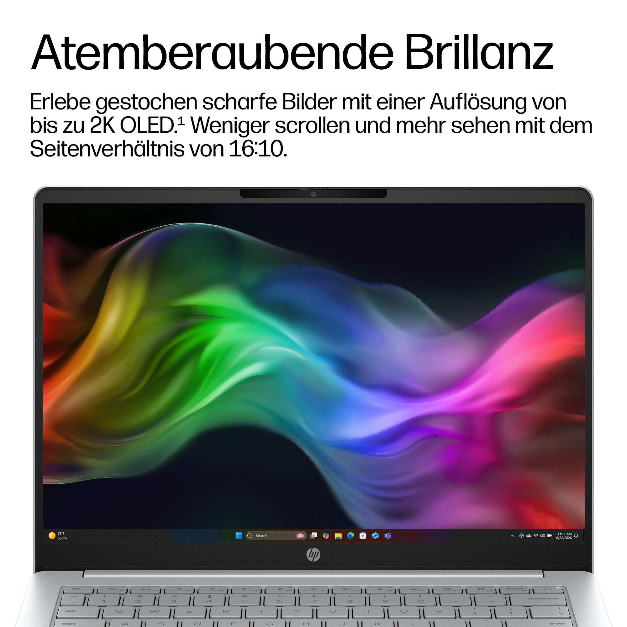 Ein Laptop mit einem lebendigen, bunten abstrakten Hintergrundbild auf dem 2K-OLED-Bildschirm.