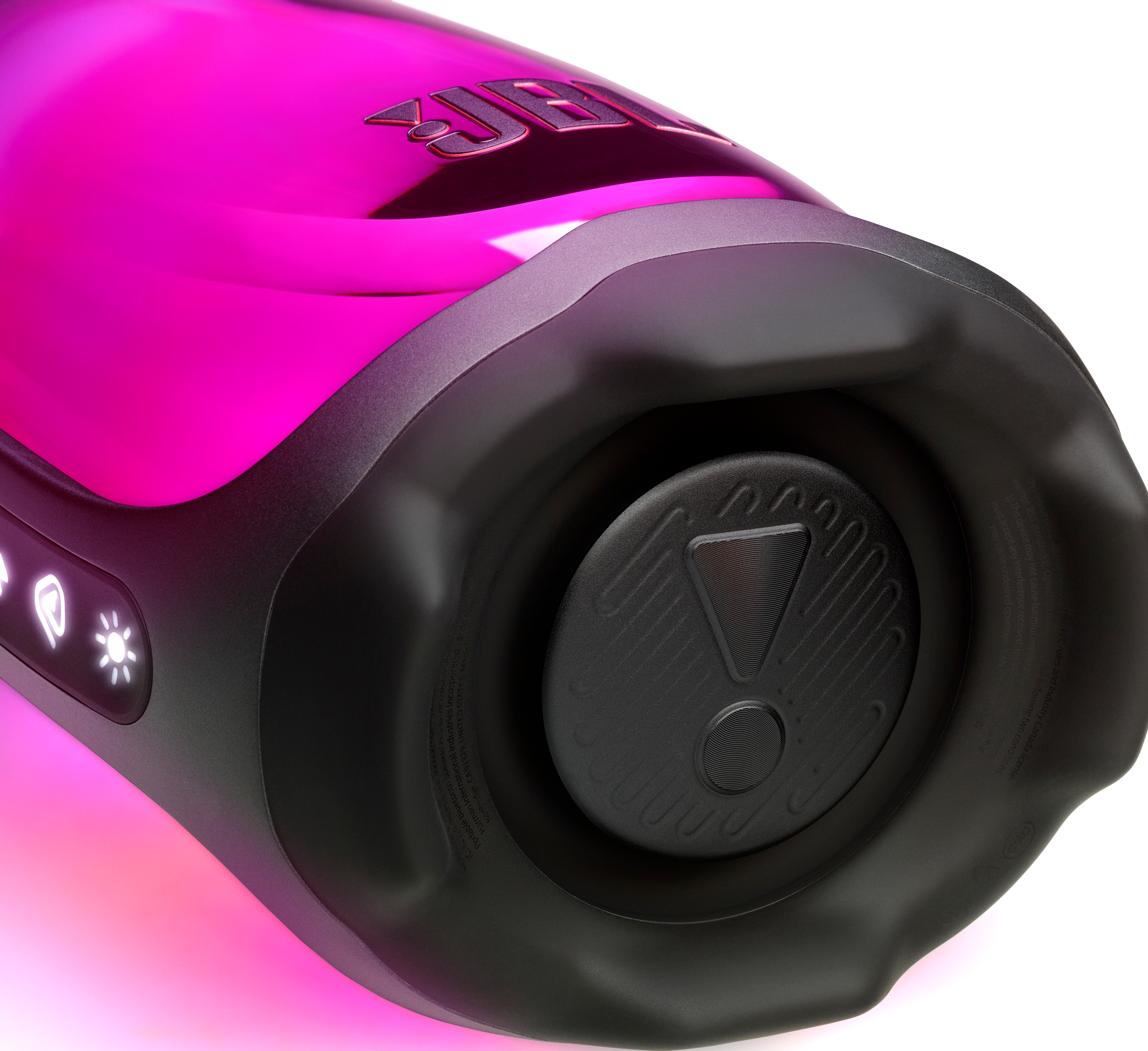 Gros plan d'une enceinte sans fil rose avec une extrémité noire et des boutons lumineux.