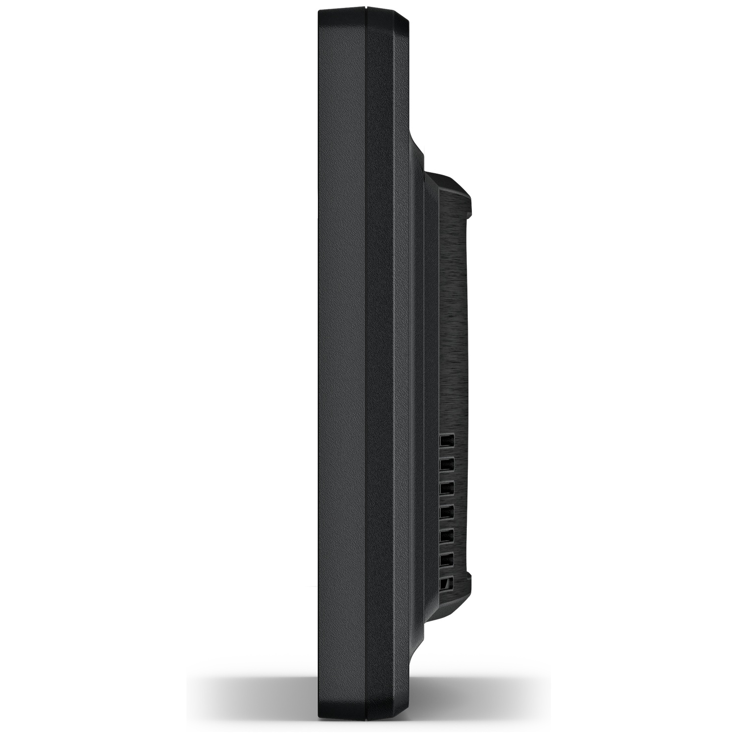 Side view of a black electronic device with ventilation slots on a white surface.