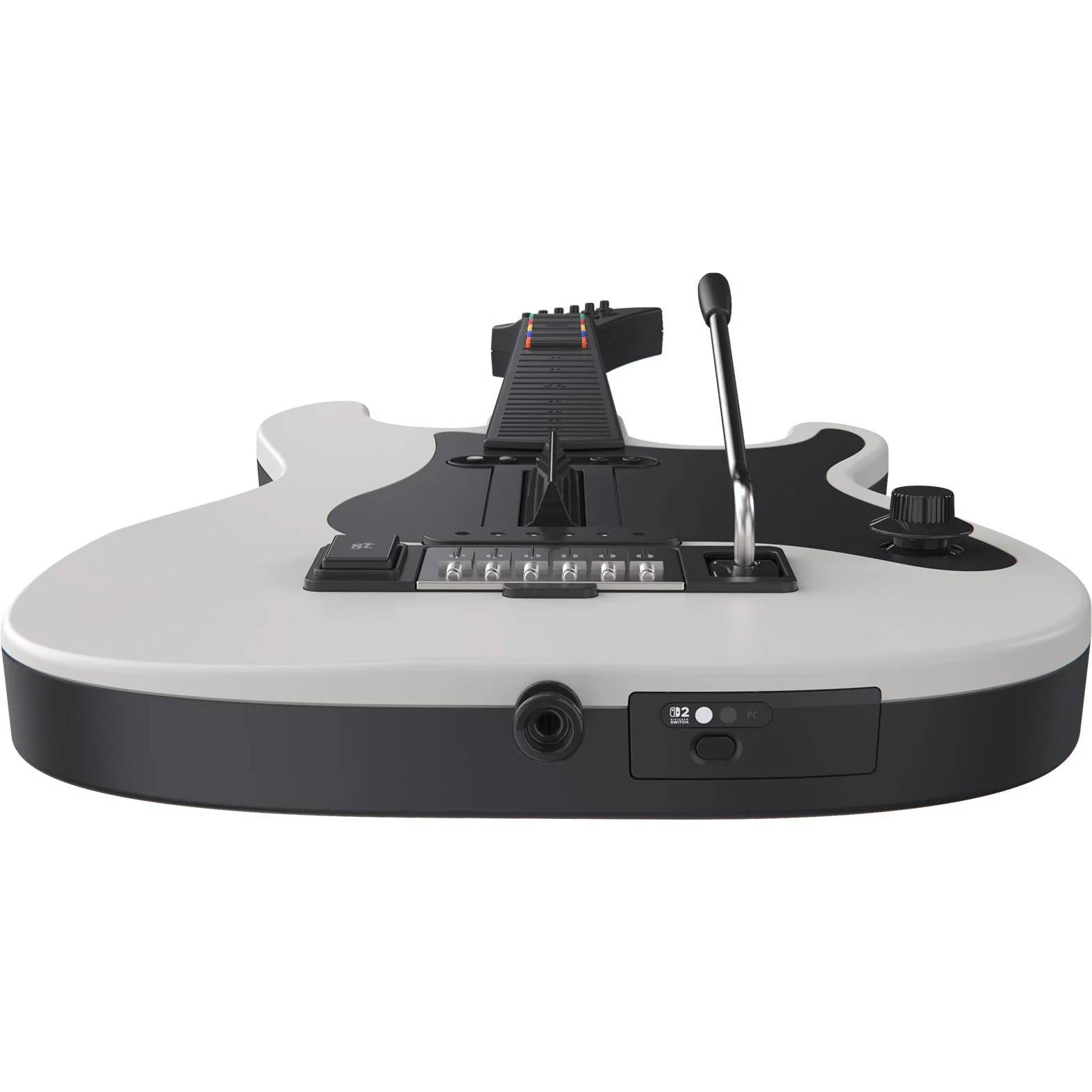 Una guitarra de videojuegos blanca y negra con botones, interruptores y una palanca de trémolo, aislada en fondo blanco.