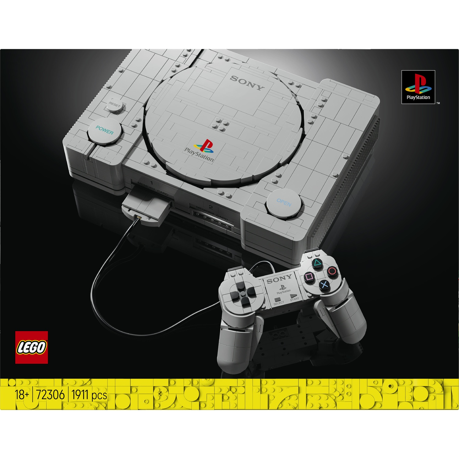 Console PlayStation Lego grigia con controller su sfondo nero.