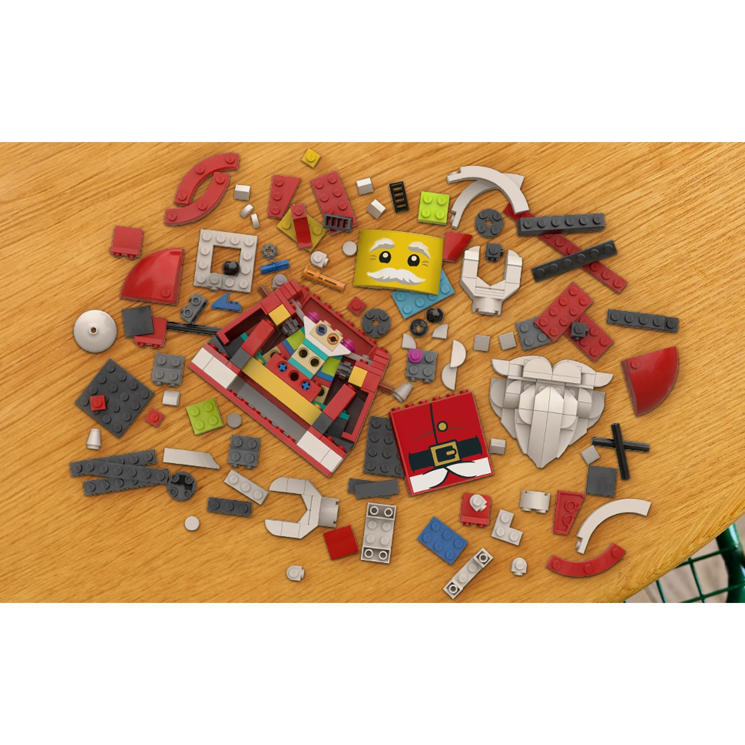Vari mattoncini e componenti Lego colorati sparsi su un tavolo di legno.