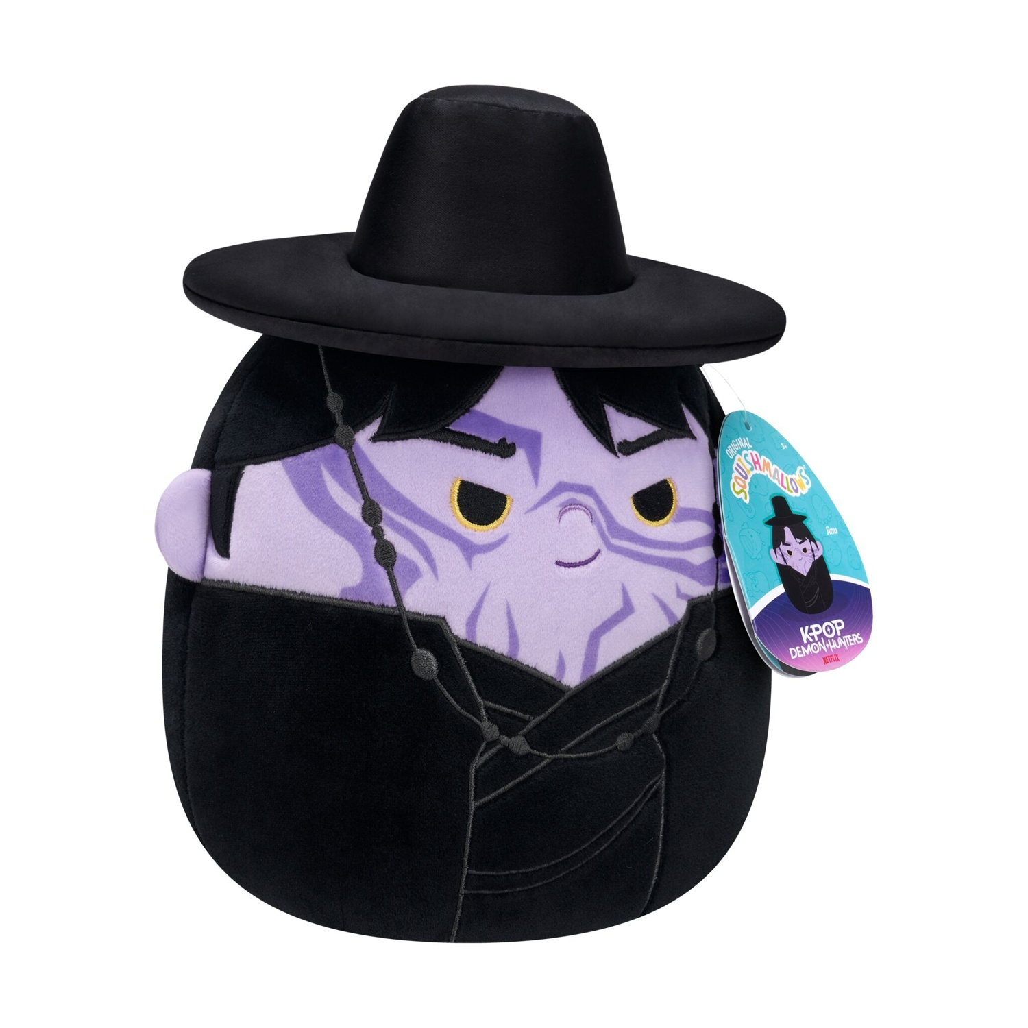 Peluche viola con cappello e tunica neri.