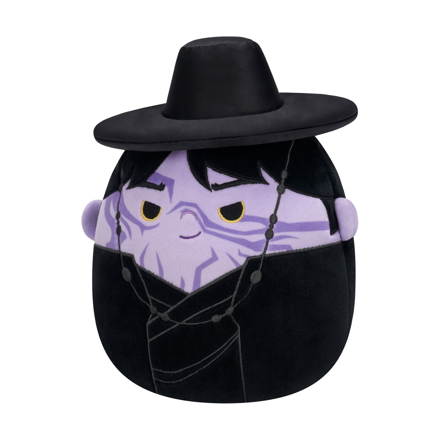 Morbido peluche con viso viola, cappello nero e vestiti neri su sfondo bianco.