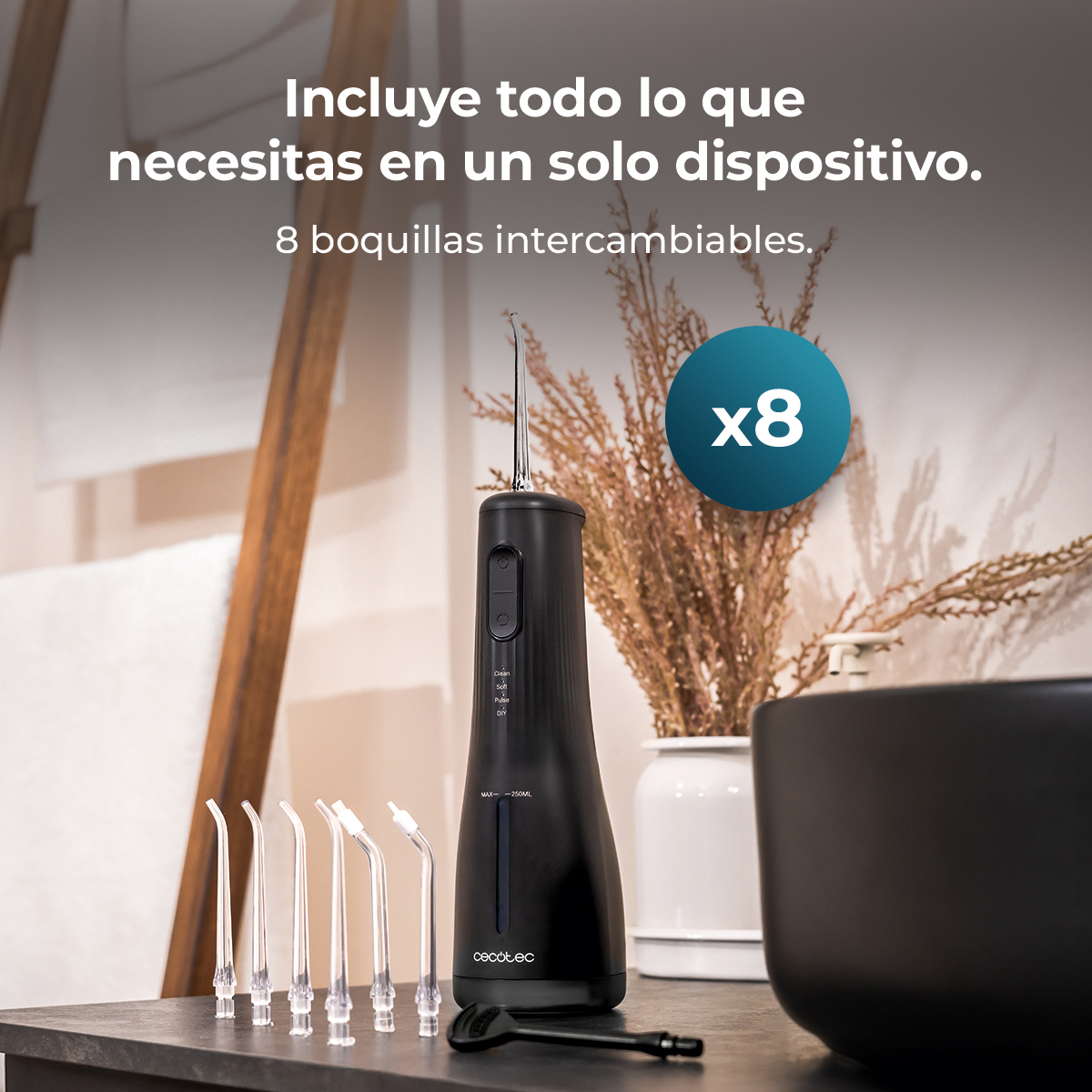 Irrigador bucal negro con ocho boquillas intercambiables en un tocador de baño.