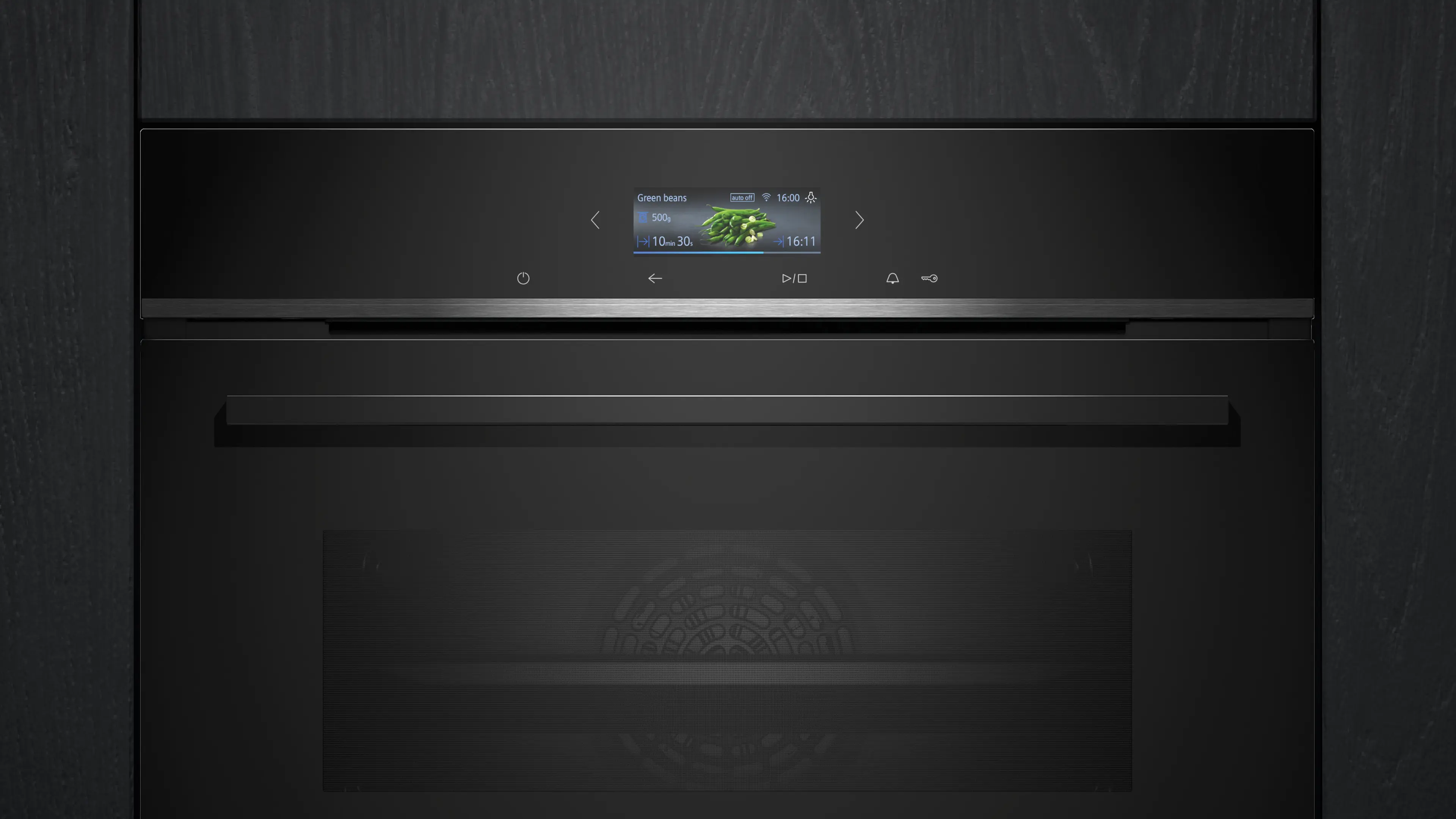 Un horno negro con pantalla digital que muestra judías verdes, 500g y tiempo de cocción.
