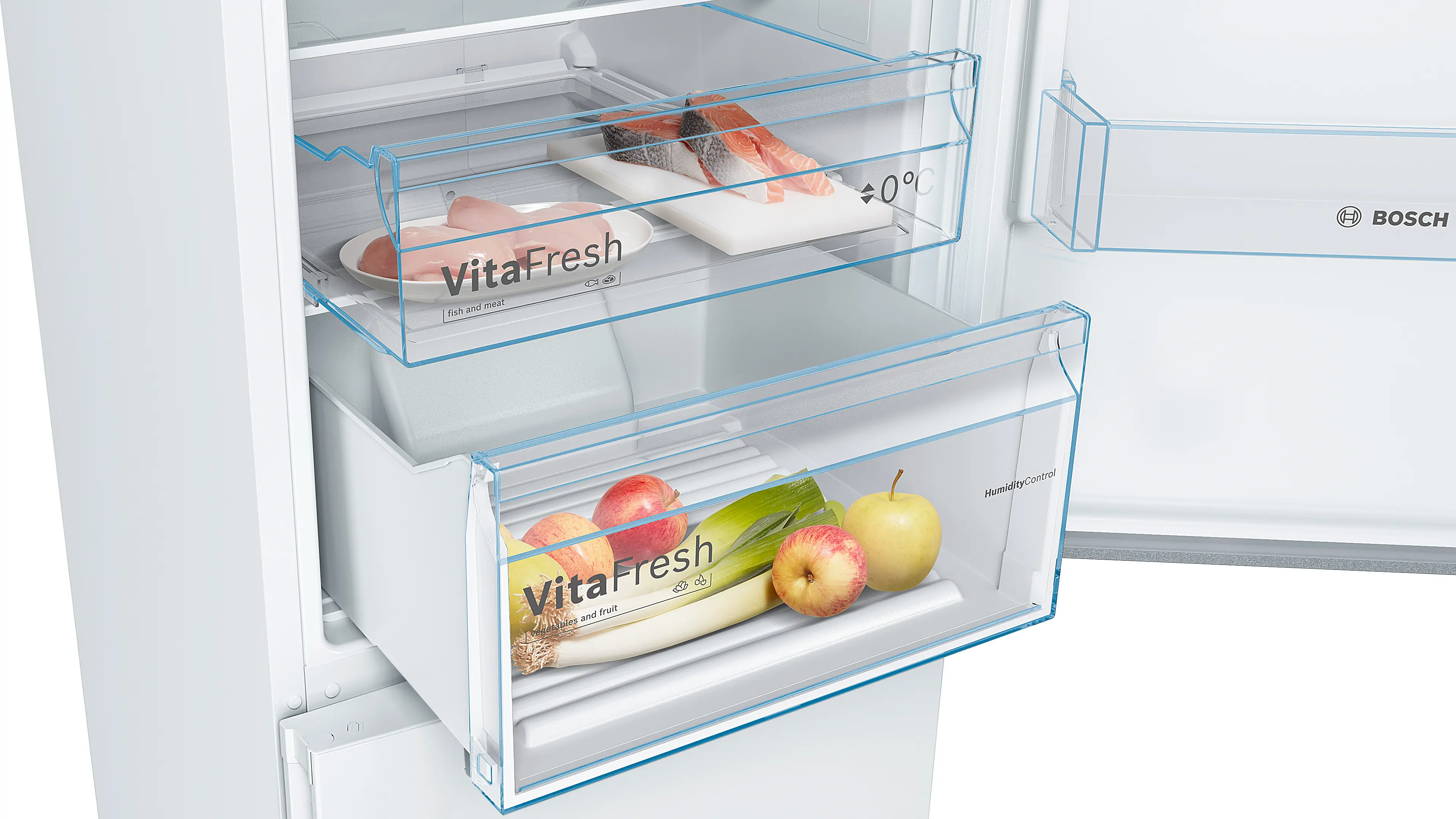 Frigorífico Bosch abierto con cajones VitaFresh que contienen carne y verduras.