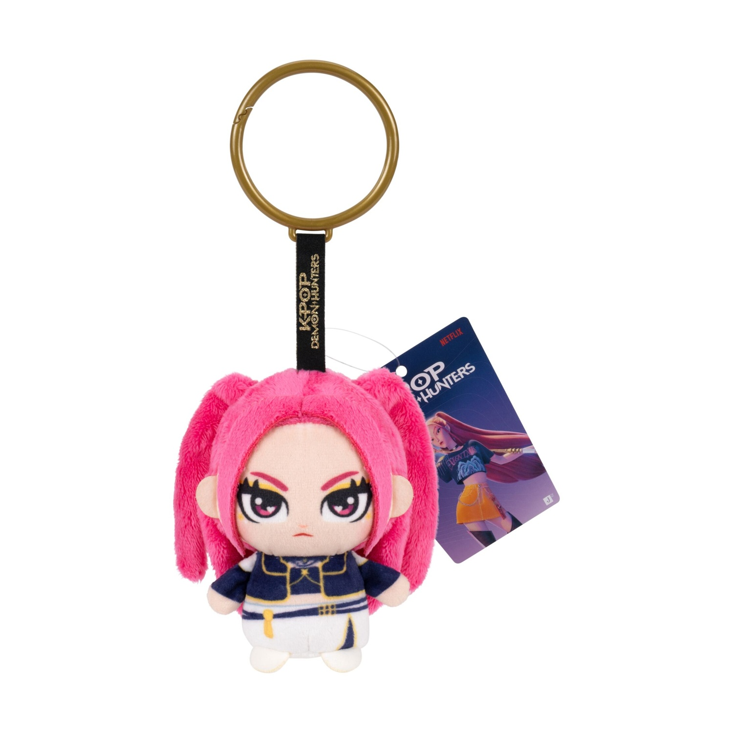 Un portachiavi di peluche con capelli rosa, occhi scuri e abbigliamento blu e bianco, con un'etichetta Netflix.