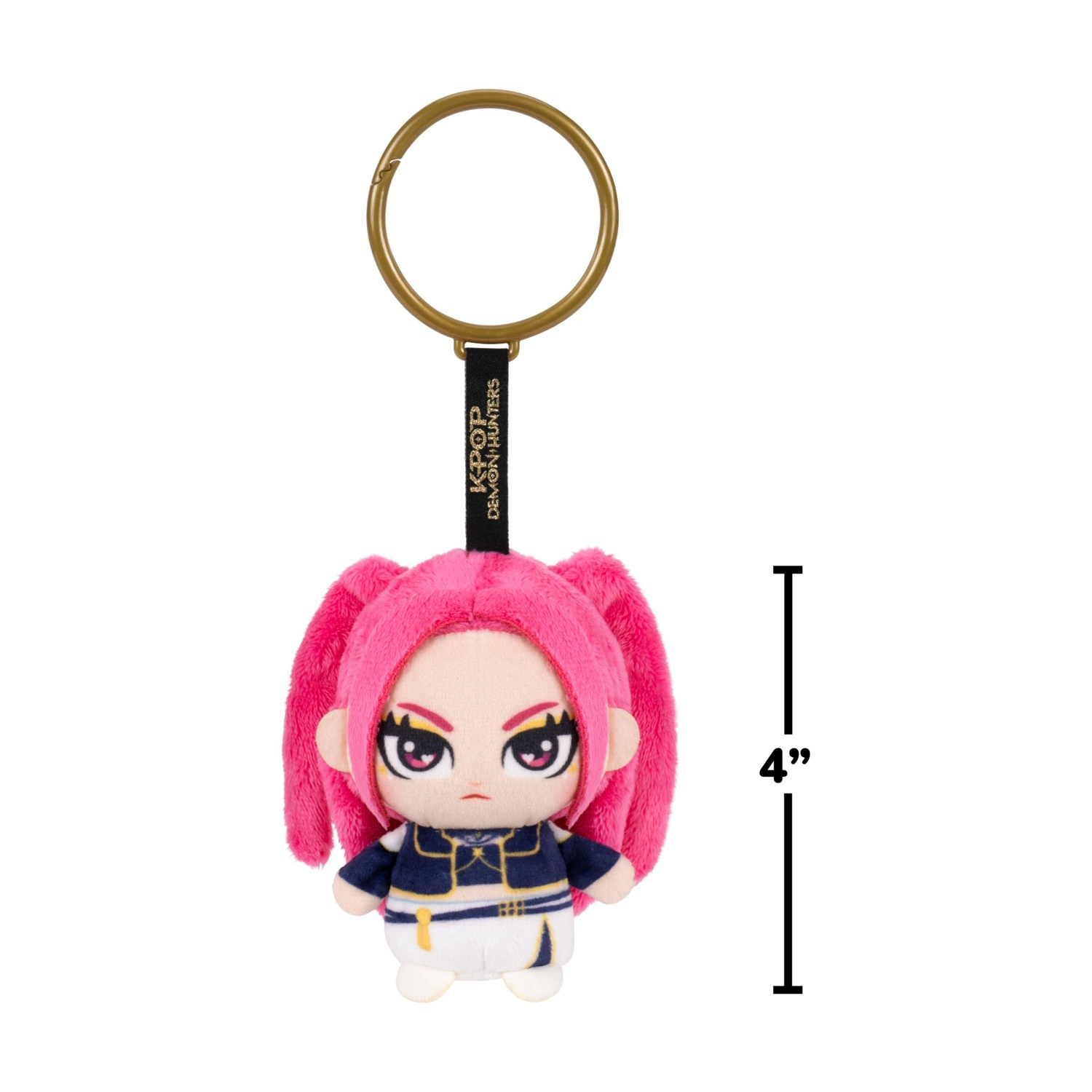 Portachiavi in peluche di 10 cm di un personaggio con codine rosa, vestiti blu e bianchi e anello dorato.