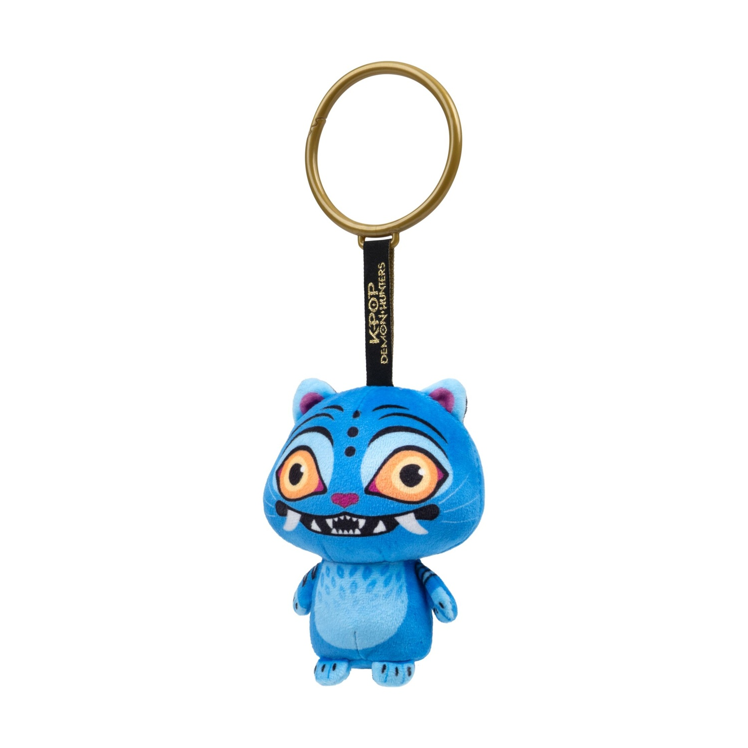 Un portachiavi in peluche blu con grandi occhi gialli, zanne e un anello dorato su sfondo bianco.
