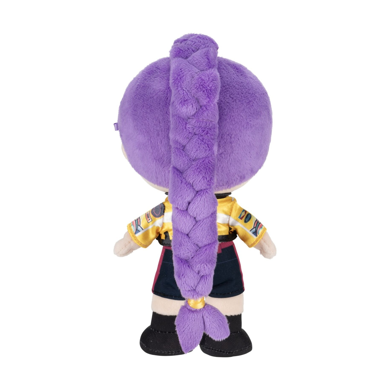 Vista posteriore di una bambola di peluche con una lunga coda di cavallo viola intrecciata, top giallo e pantaloncini neri.
