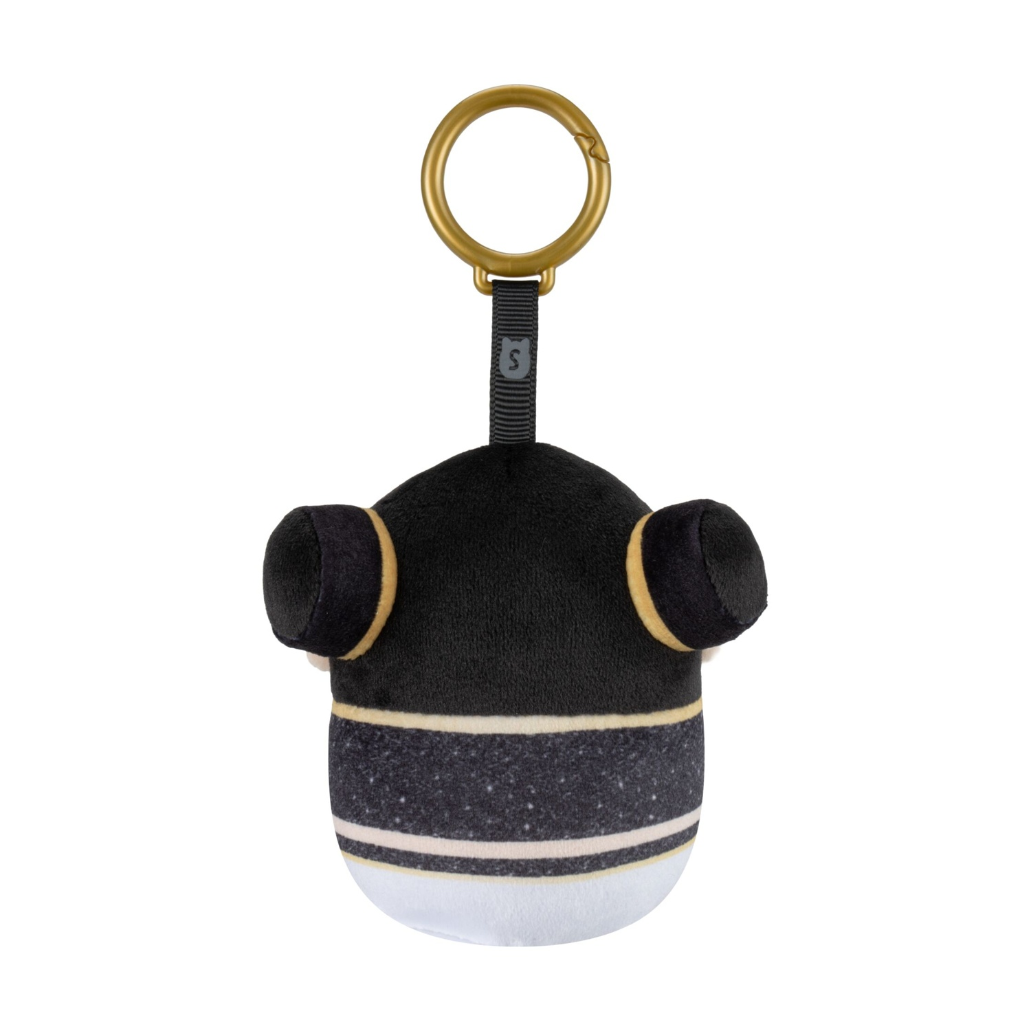 Un portachiavi di peluche bianco e nero con anello dorato e crocchie laterali.