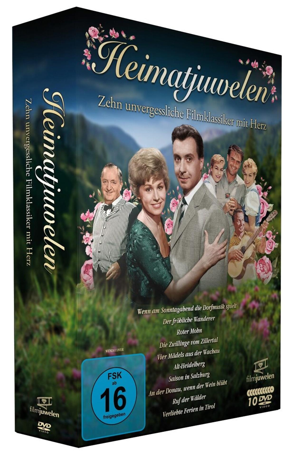 DVD-Box "Heimatjuwelen" mit zehn Filmklassikern vor Bergkulisse und mit rosa Blumen.