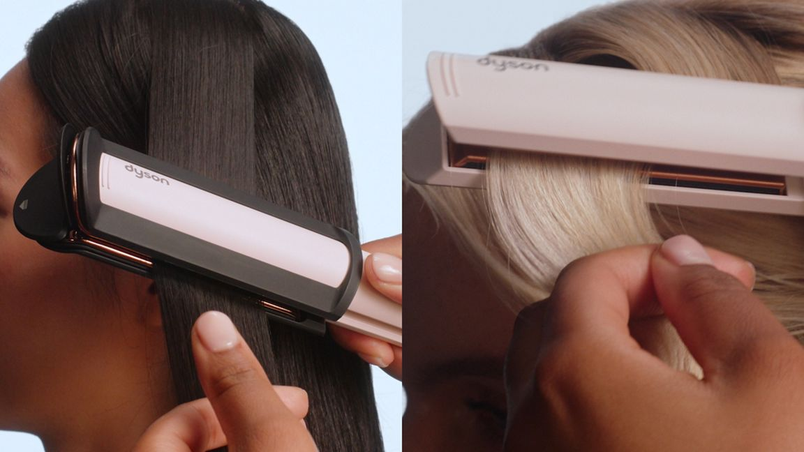 Zwei Hände verwenden ein rosafarbenes Dyson-Glätteeisen, um dunkles und blondes Haar zu glätten.