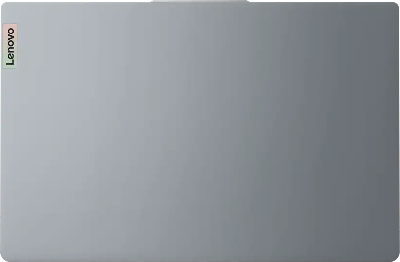 Zárt szürke Lenovo laptop felülről, függőleges logóval a bal szélen.