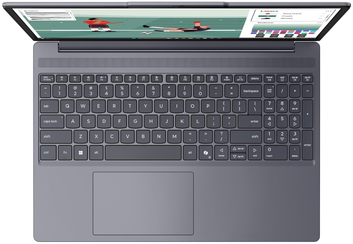 Felülnézet egy szürke laptopról, nyitott képernyőjén focimeccsel.