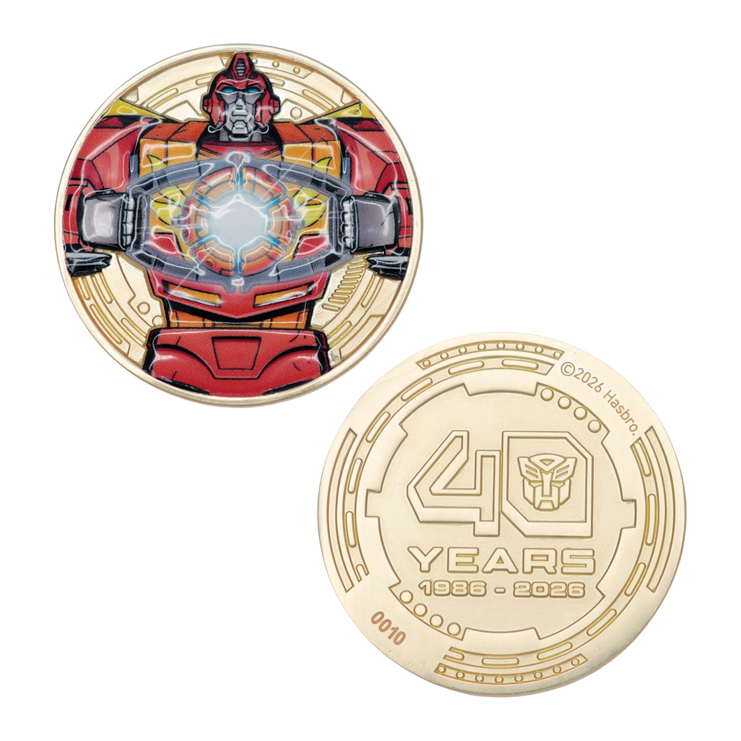 Moneda dorada de Transformers con Hot Rod y el texto 40 Years 1986-2026.