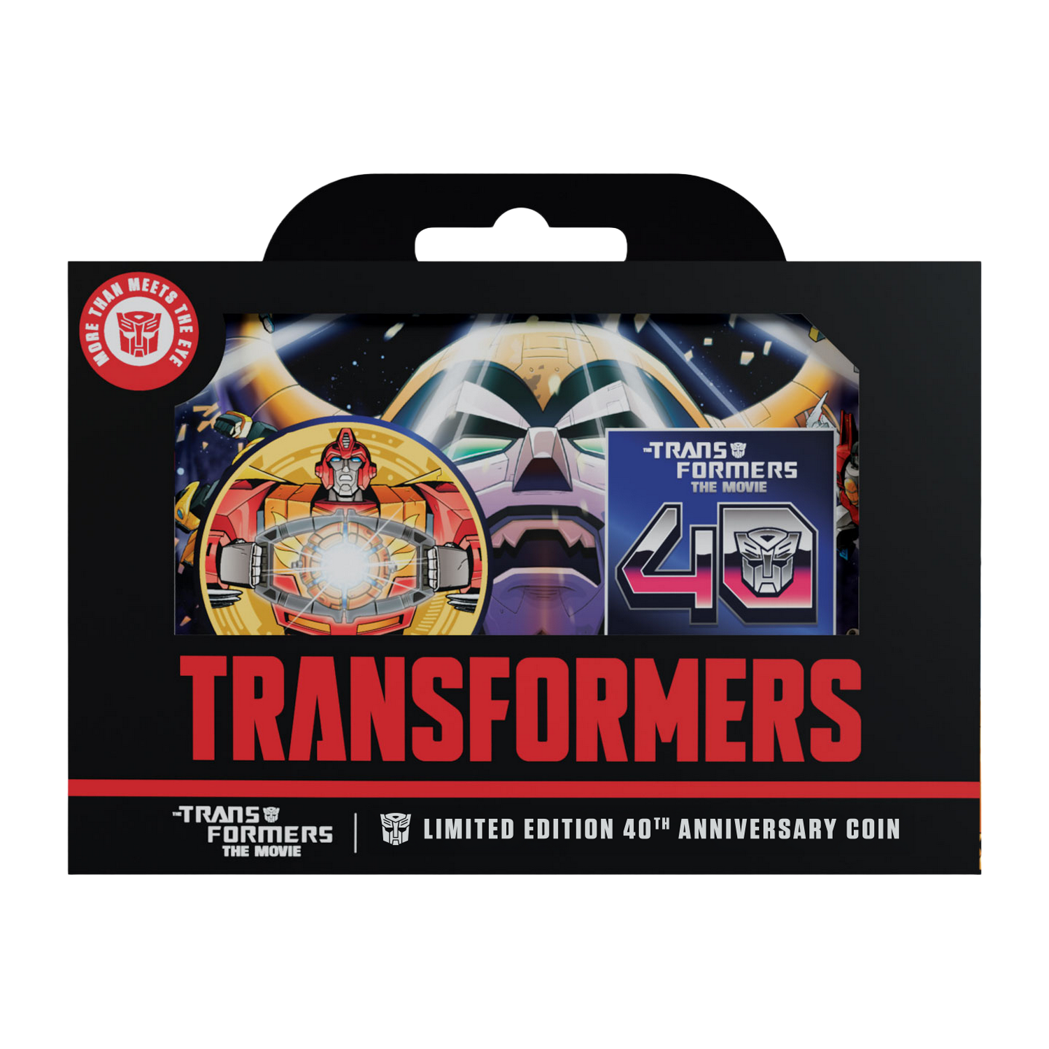 Moneda de 40 aniversario de Transformers en caja negra con arte de personajes.