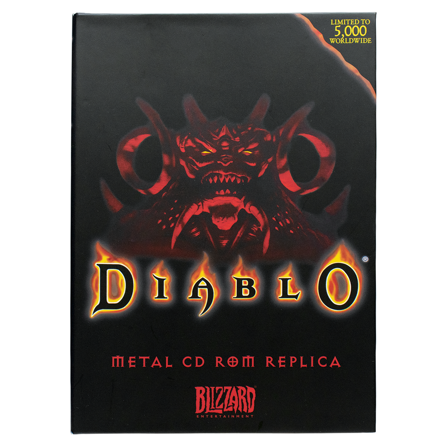 Caja de réplica de CD-ROM de metal negro Diablo con una cara de demonio roja y letras ardientes.