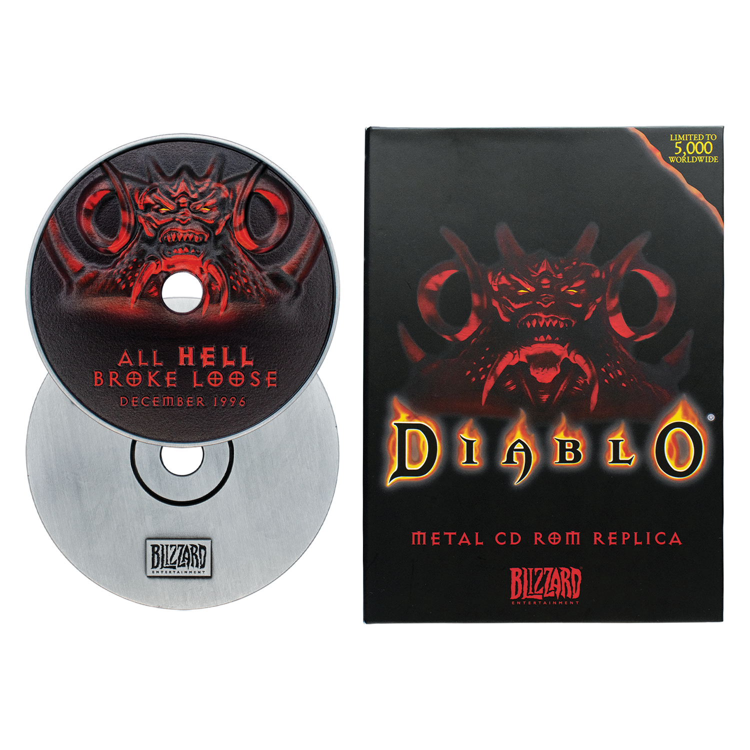 Réplica de CD-ROM de metal de Diablo con una caja y un CD con una cara de demonio roja.