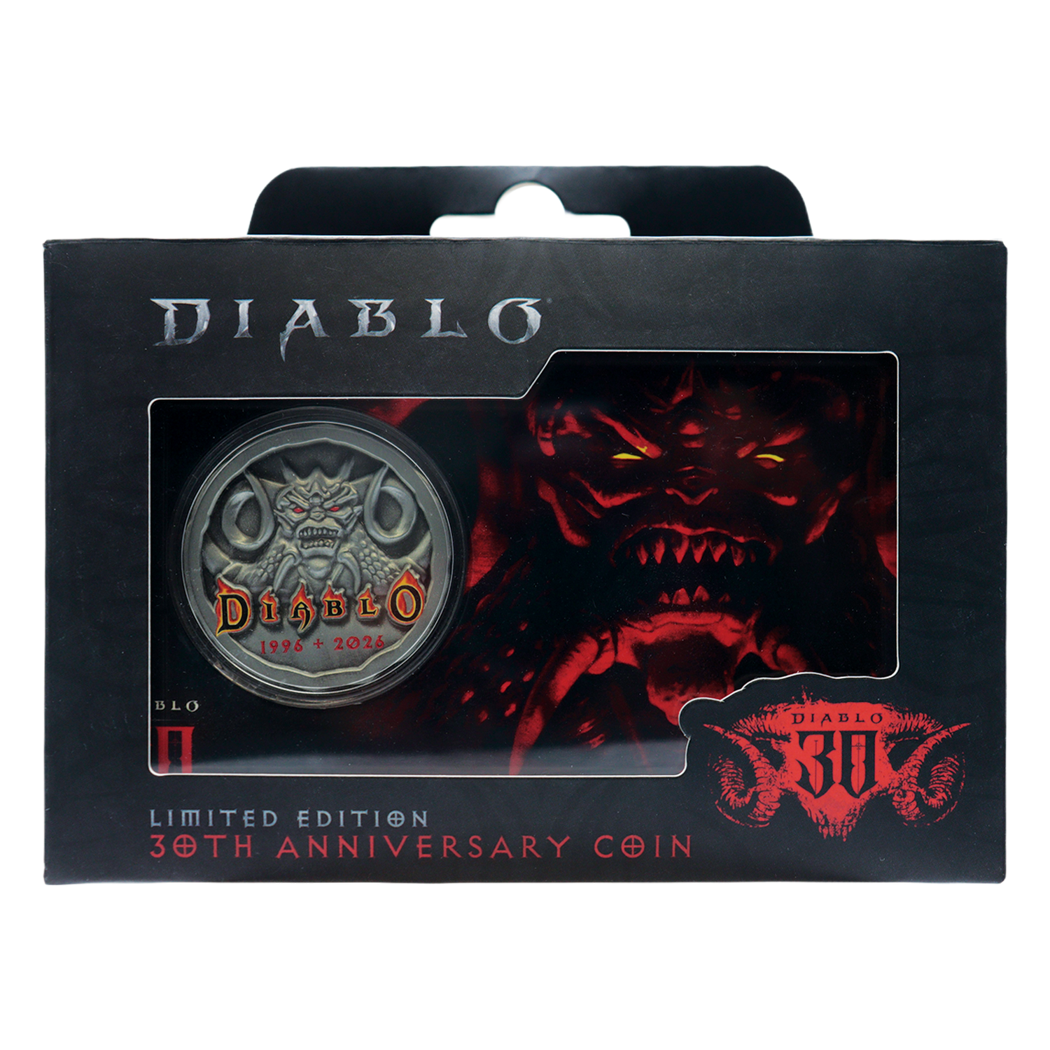 Moneda del 30 aniversario de Diablo en caja negra con arte de demonio rojo y moneda plateada con logo de Diablo.