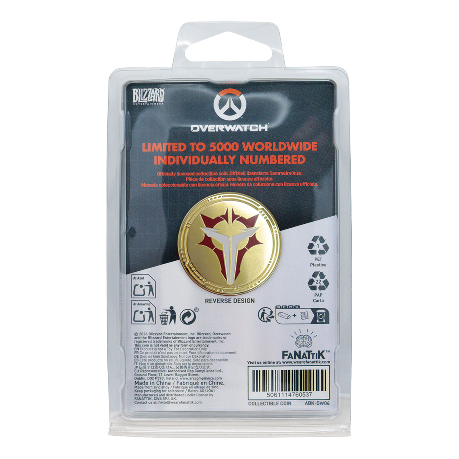 Una moneda de oro de edición limitada de Overwatch en su embalaje original, con un emblema rojo y blanco.