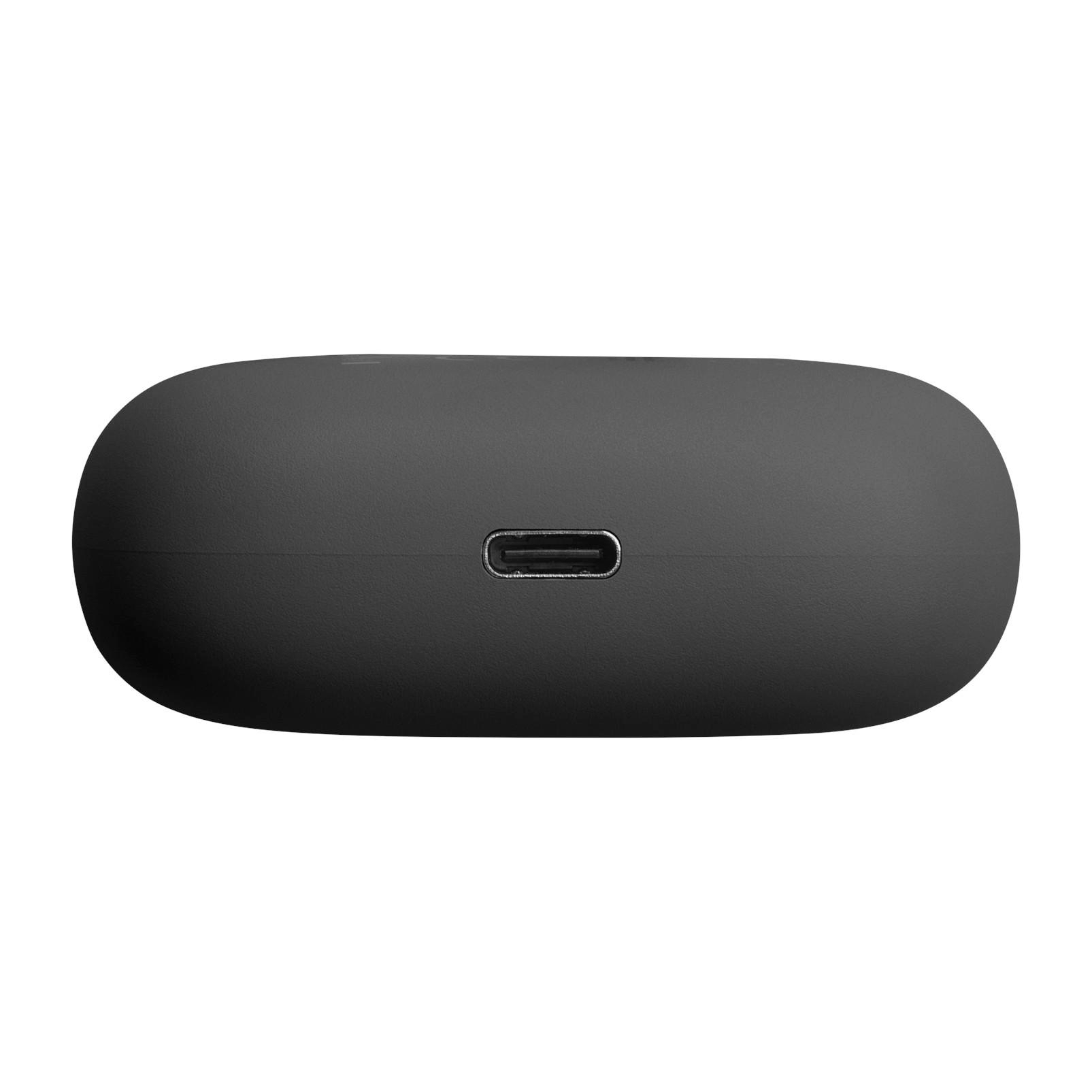 Ein schwarzes, pillenförmiges Ladecase mit einem silbernen USB-C-Anschluss in der Mitte auf weißem Hintergrund.