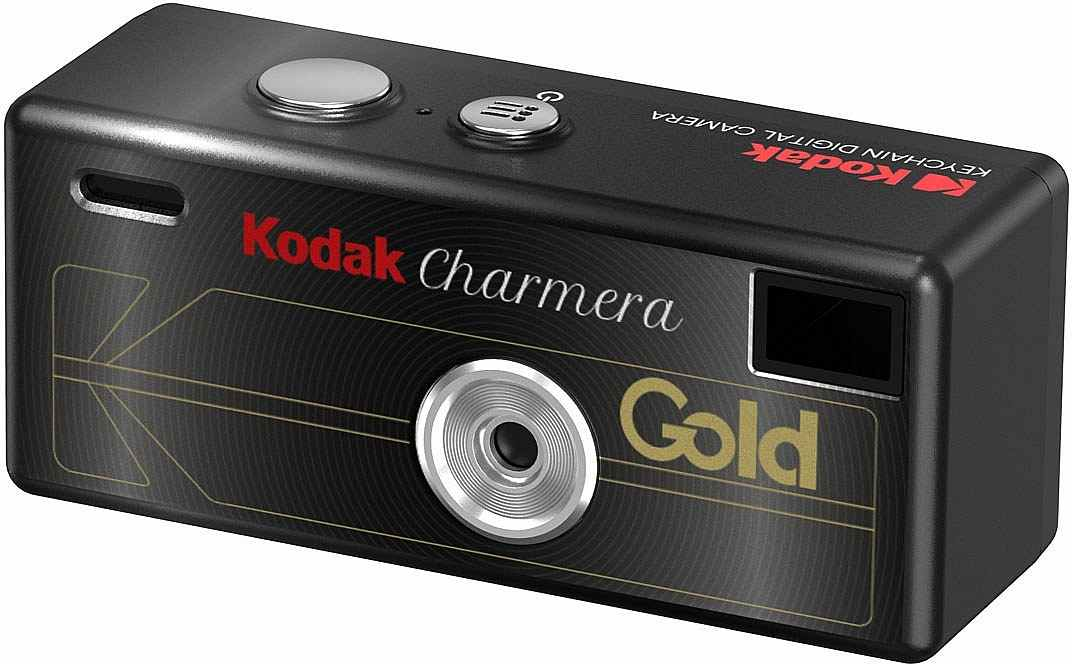 Un appareil photo numérique porte-clés Kodak Charmera noir avec accents dorés, objectif et viseur sur fond clair.
