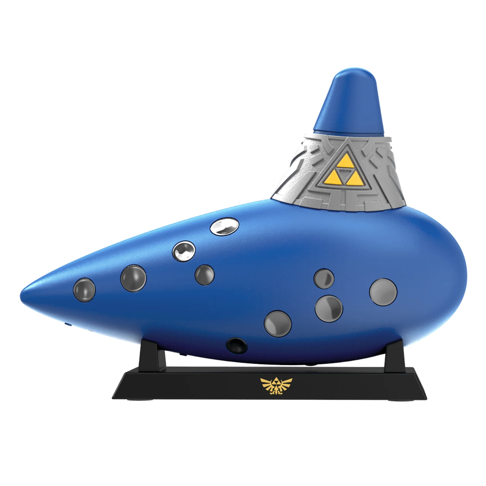 Ocarina azul con símbolo Triforce amarillo, sobre soporte negro en fondo blanco.