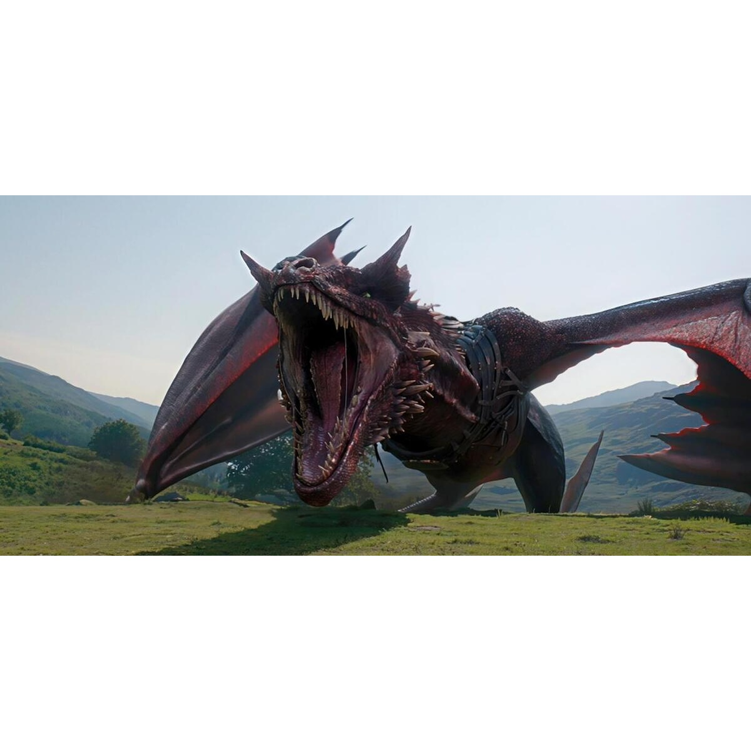 A large red dragon roars with an open mouth on a green field in front of a hilly landscape.