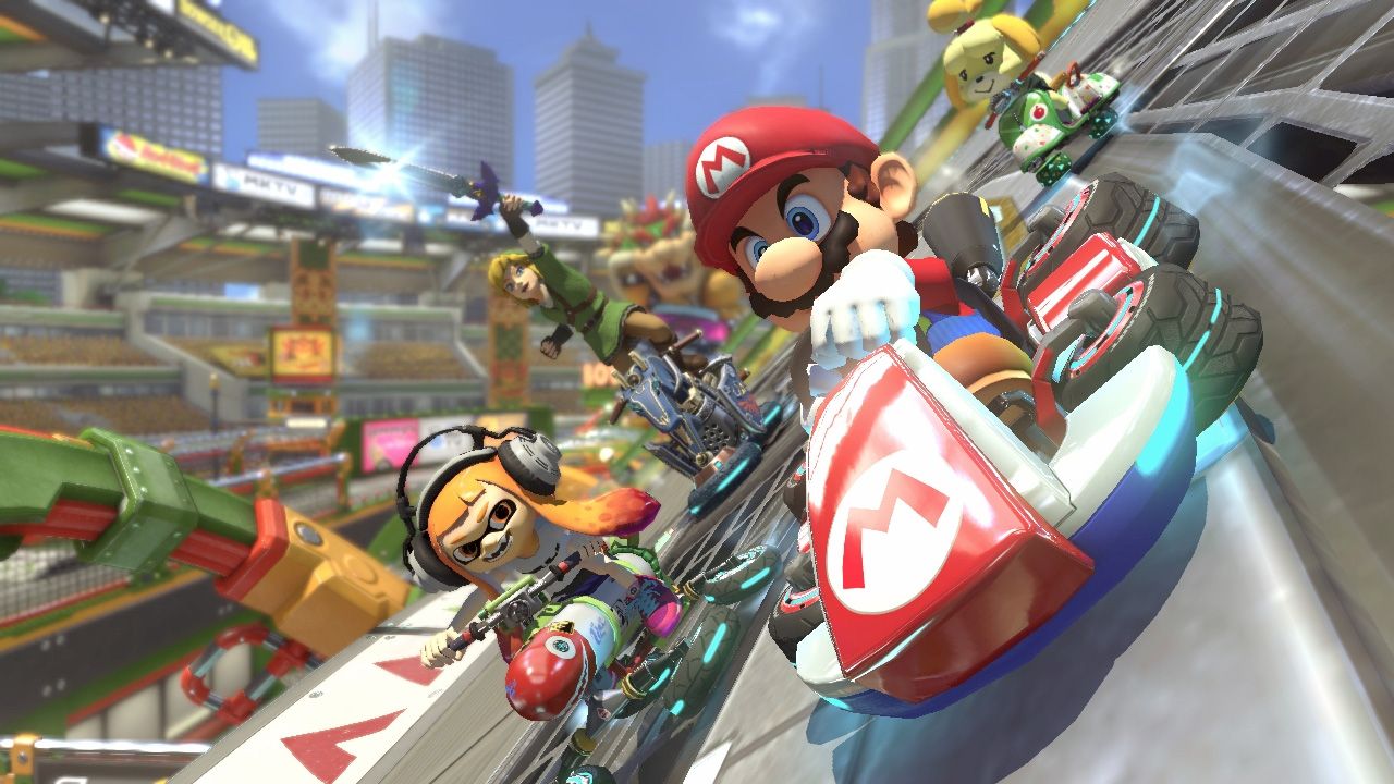 Mario und andere Nintendo-Charaktere fahren auf einer futuristischen Rennstrecke Go-Kart.