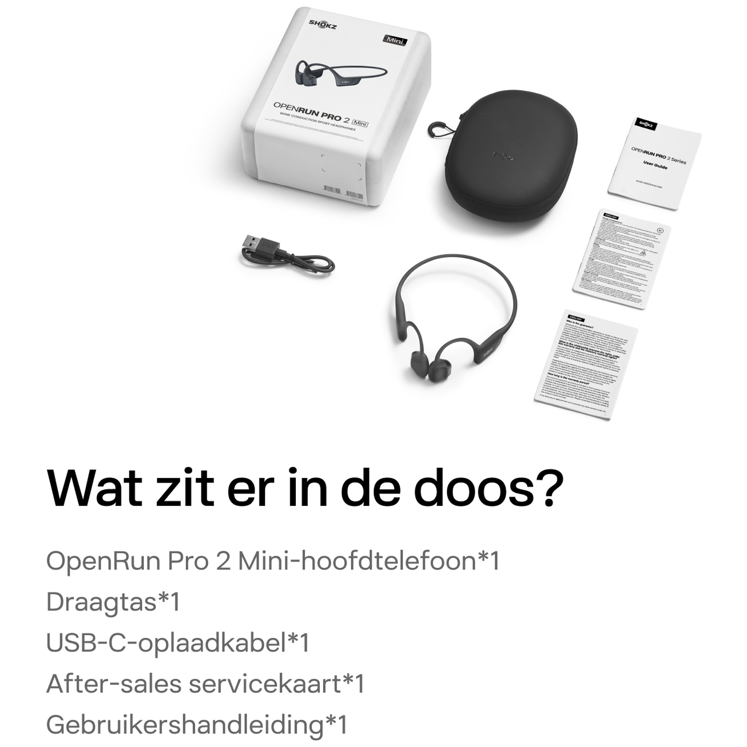 Shokz OpenRun Pro 2 Mini koptelefoon, doos, etui, USB-C kabel en handleidingen op witte achtergrond.
