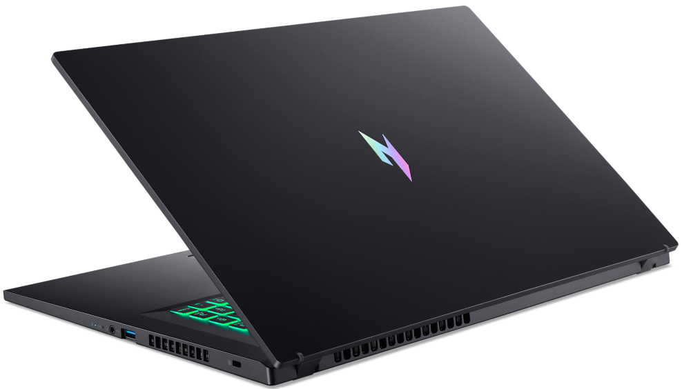 Egy fekete játék laptop színes háttérvilágítású billentyűzettel és izzó logóval a zárt fedélen.
