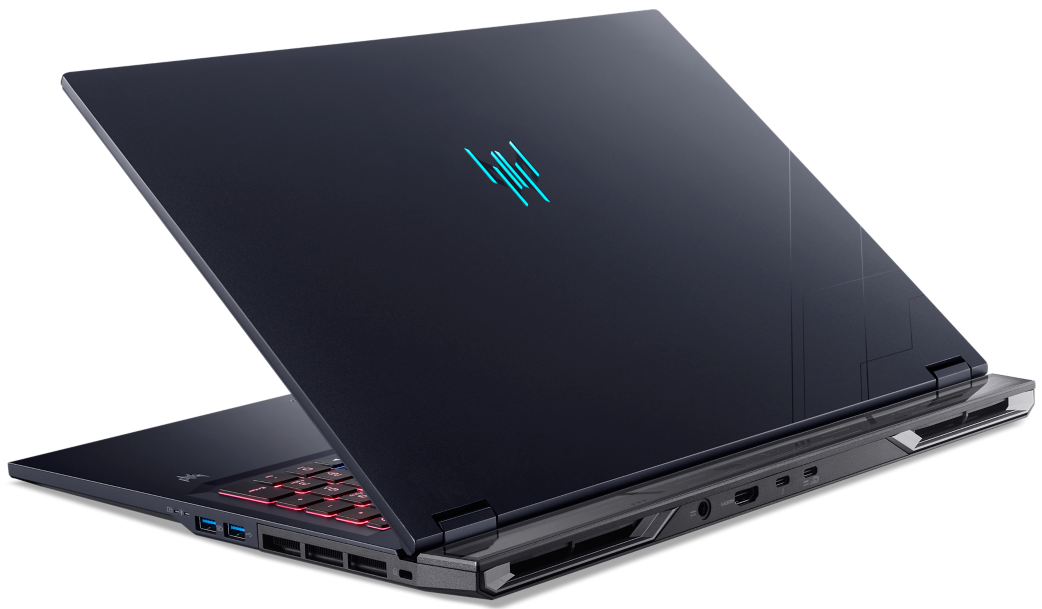 Sötétkék laptop világító kék logóval a fedélen és piros háttérvilágítású billentyűzettel.