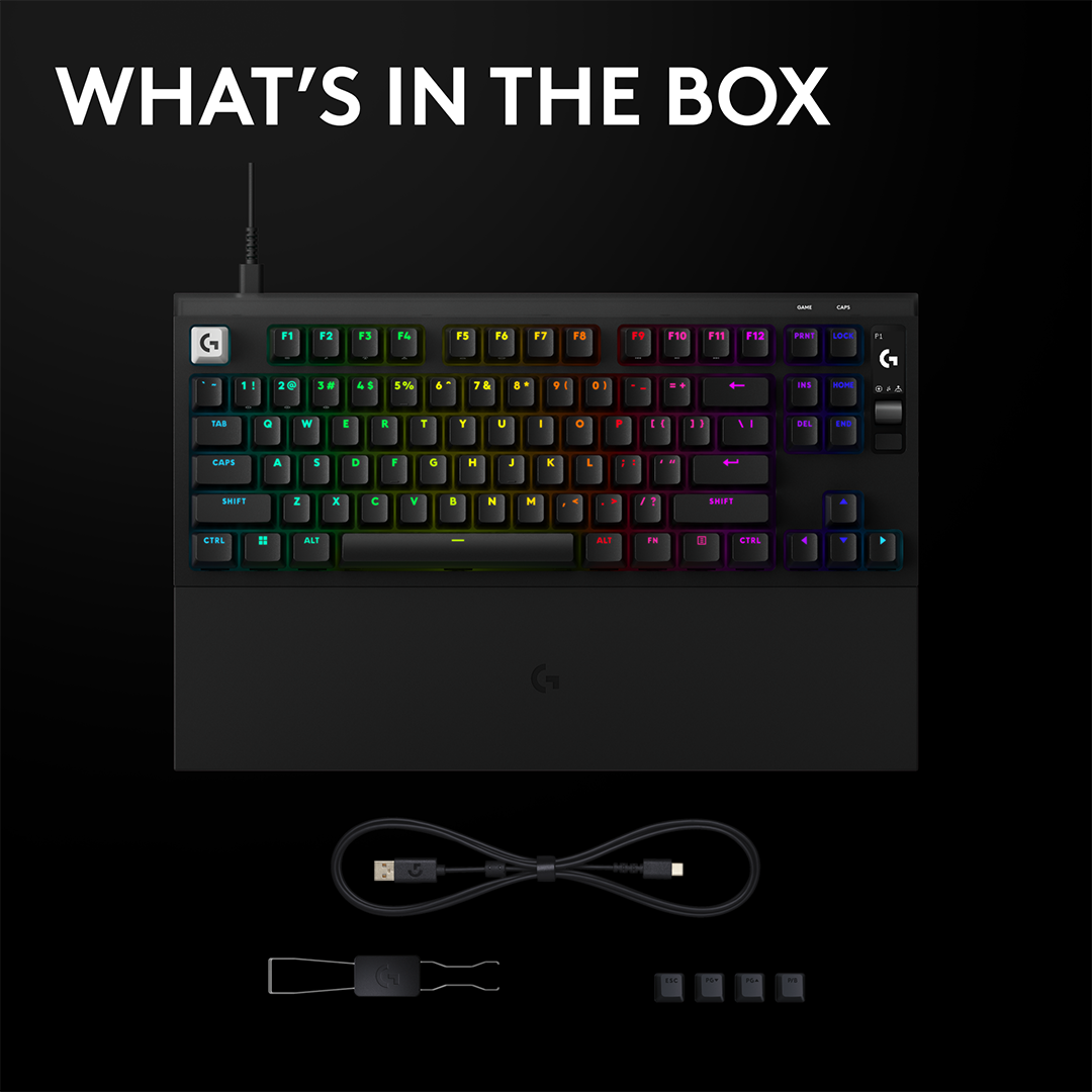 Fekete mechanikus billentyűzet RGB világítással, USB kábellel, billentyűsapkakiszedővel és négy pótkulccsal fekete háttérrel.