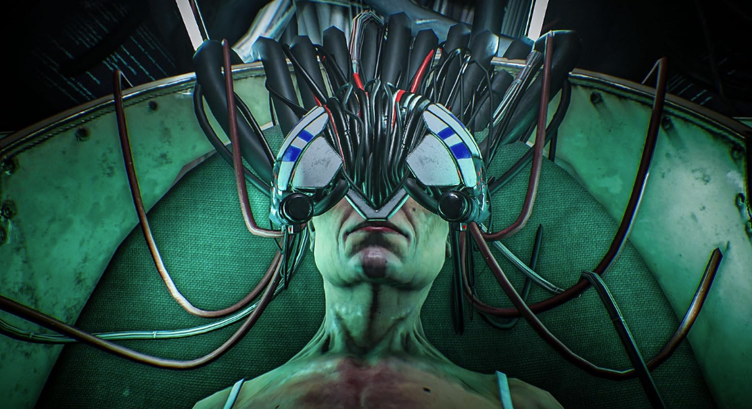 Eine Person liegt mit einem VR-Headset auf, das durch zahlreiche Kabel mit einer grünen Maschine verbunden ist.