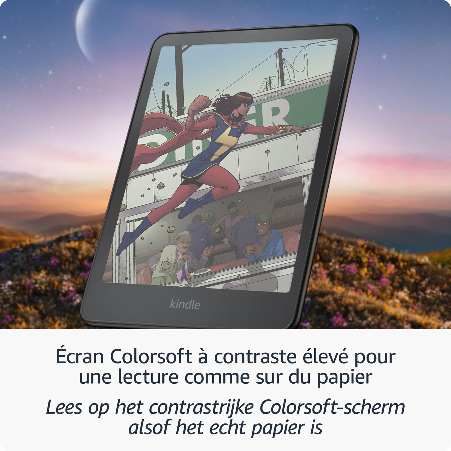 Liseuse Kindle avec écran couleur affichant une super-héroïne de BD ; en arrière-plan, collines et ciel crépusculaire.