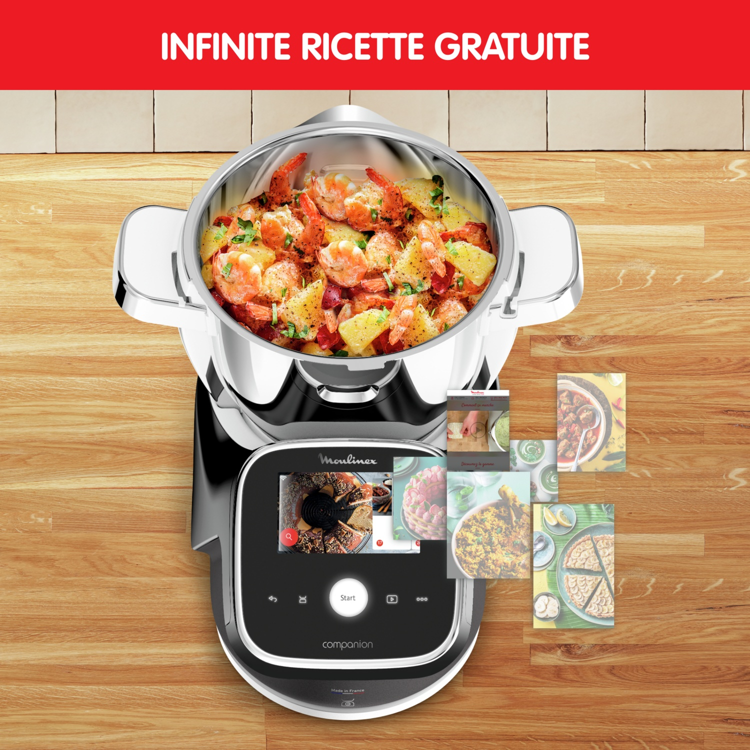 Un robot da cucina Moulinex su un tavolo di legno con gamberi e patate, e schede di ricette.