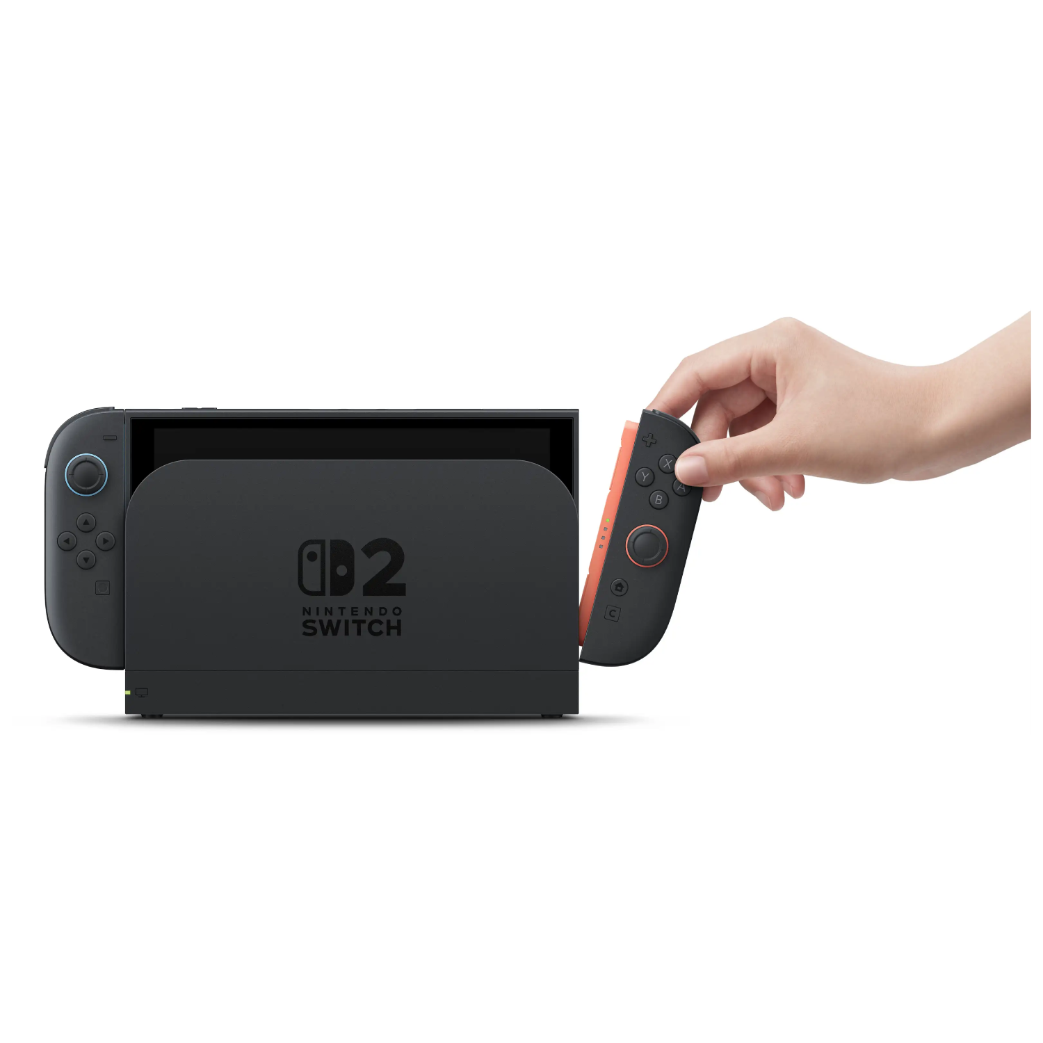 Una mano acopla un controlador Joy-Con a una consola Nintendo Switch 2 en una base negra.