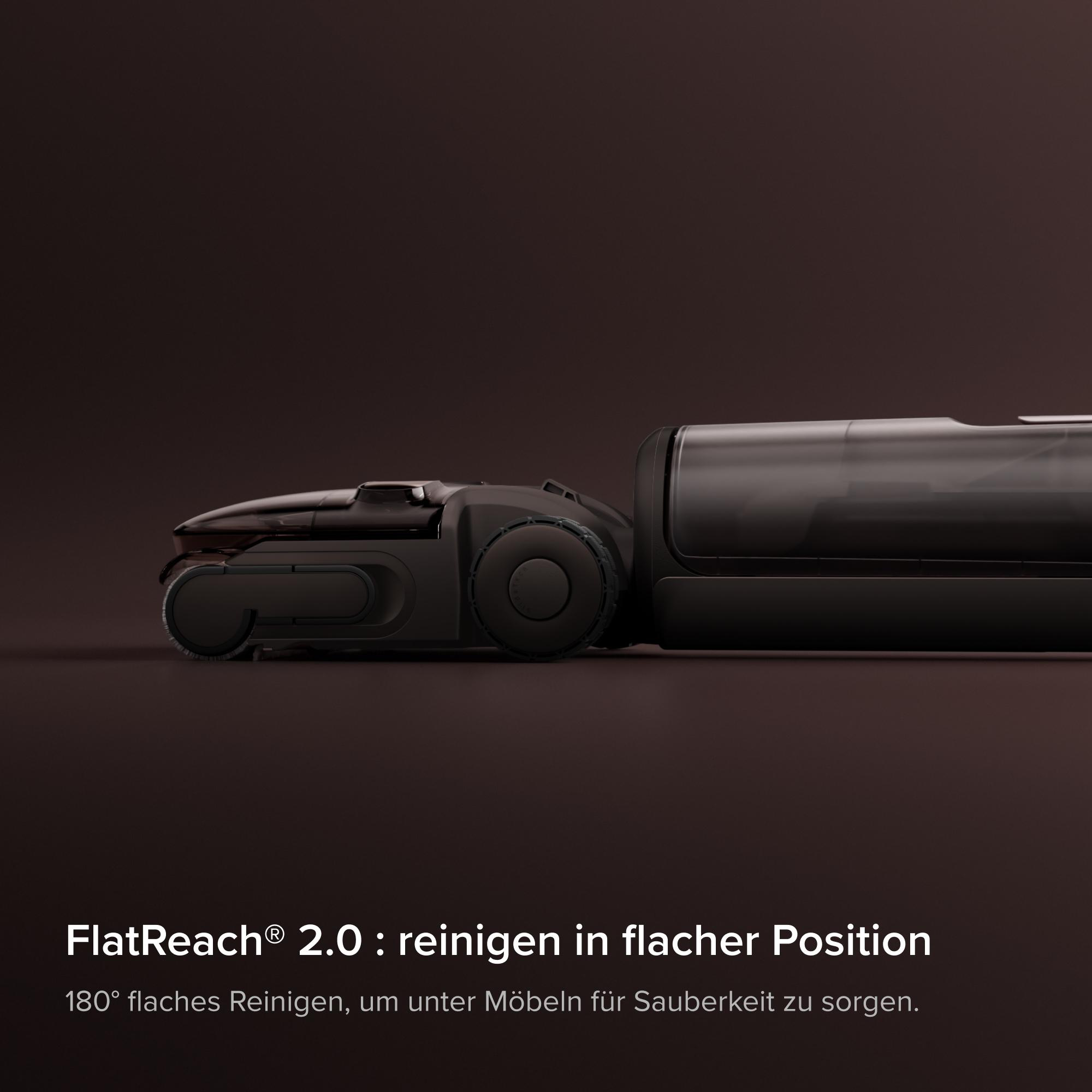 Schwarzer Staubsauger liegt flach auf dunklem Boden mit Text. FlatReach 2.0.