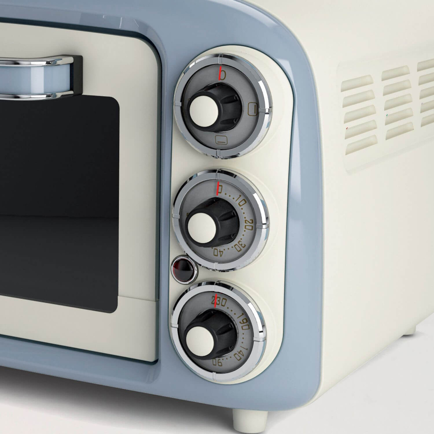 Mini forno retrò beige e blu con tre manopole di controllo rotonde e porta in vetro.