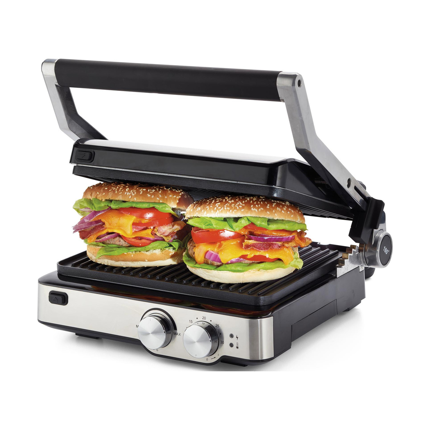 Due hamburger con formaggio e insalata vengono preparati su una piastra elettrica.