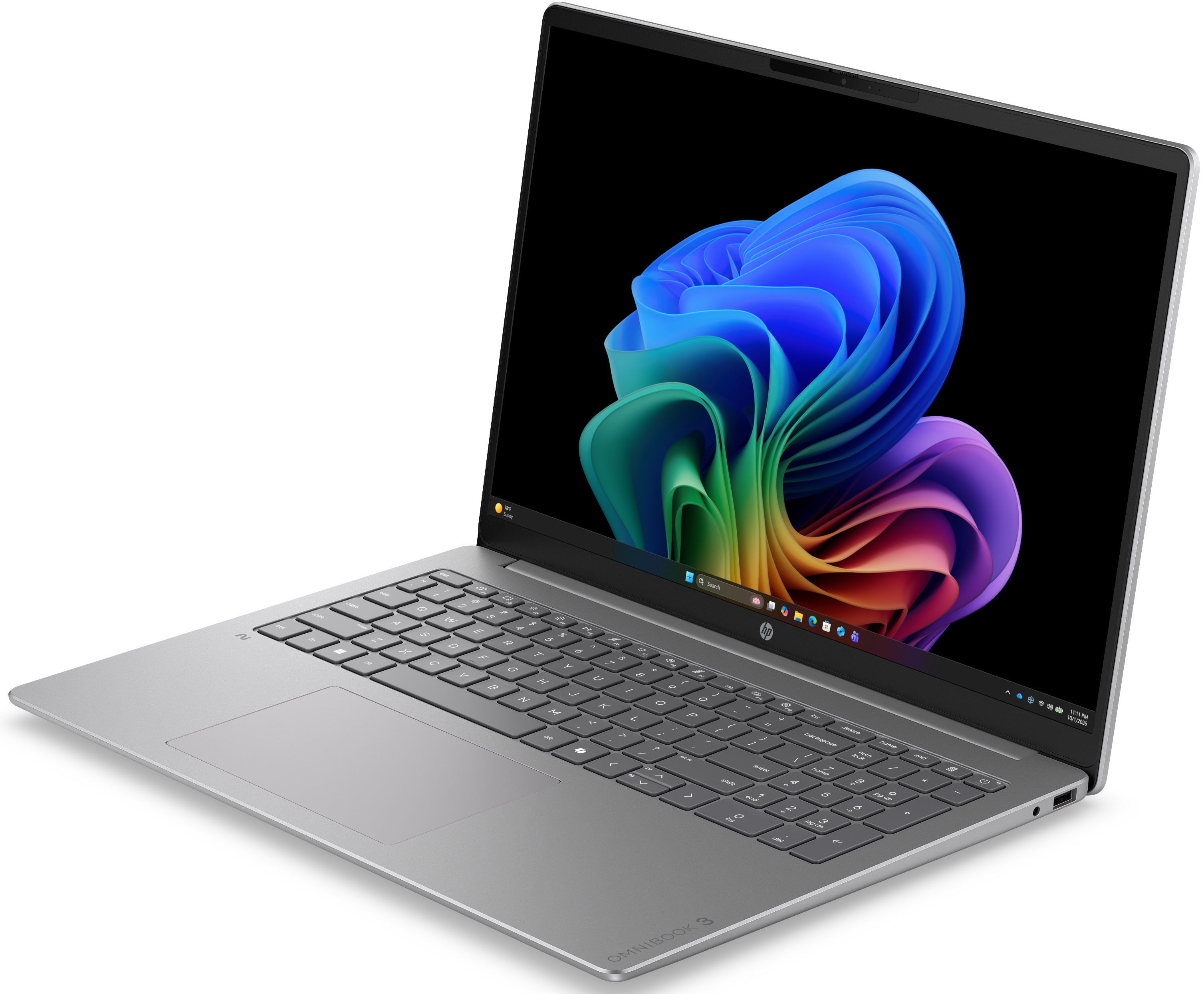 Ezüstszínű laptop fekete billentyűzettel és színes absztrakt háttérképpel a képernyőn.