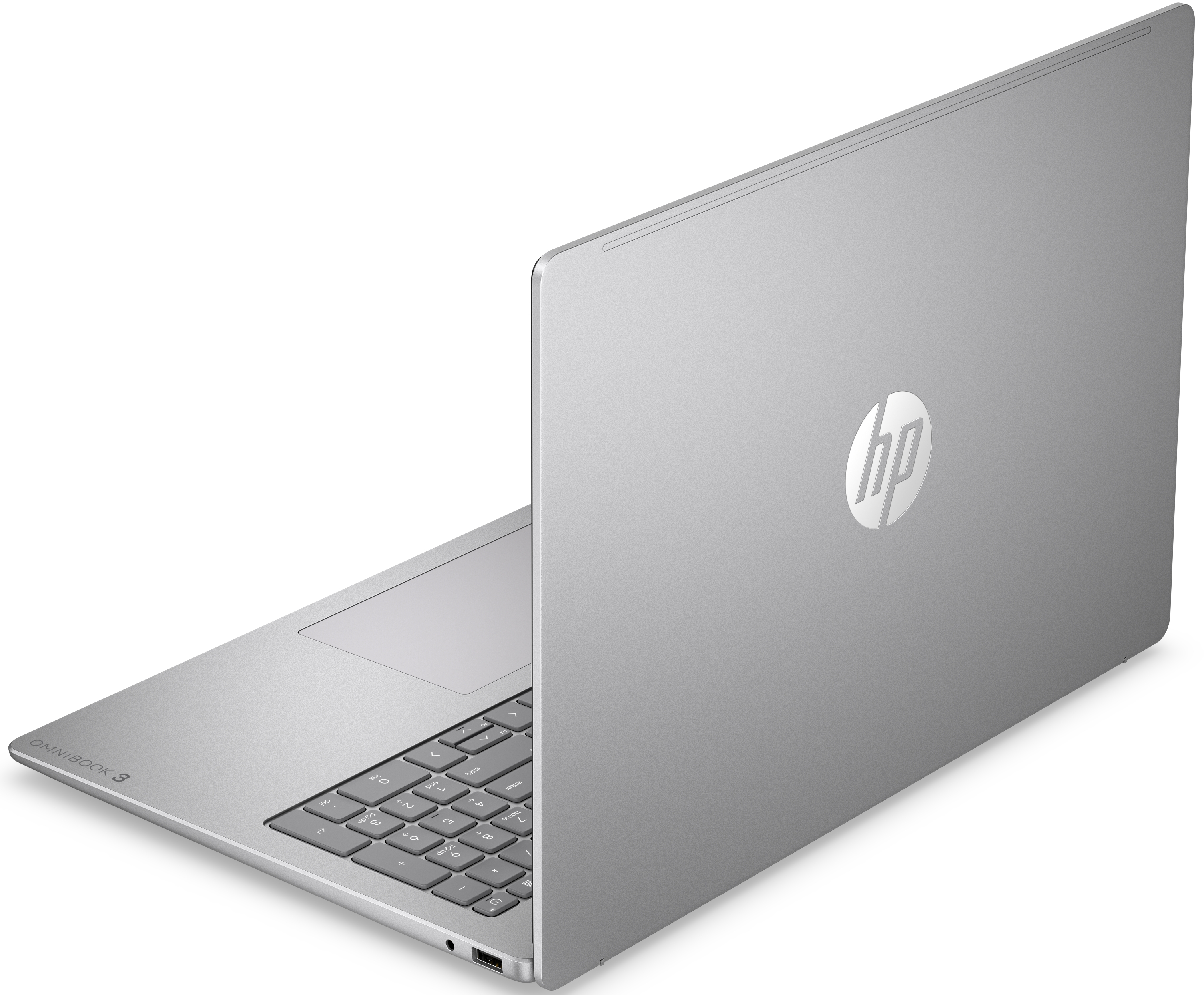 Egy ezüst színű HP Omnibook 3 laptop hátrafelé néző háromnegyedes nézetben, fehér felületen.