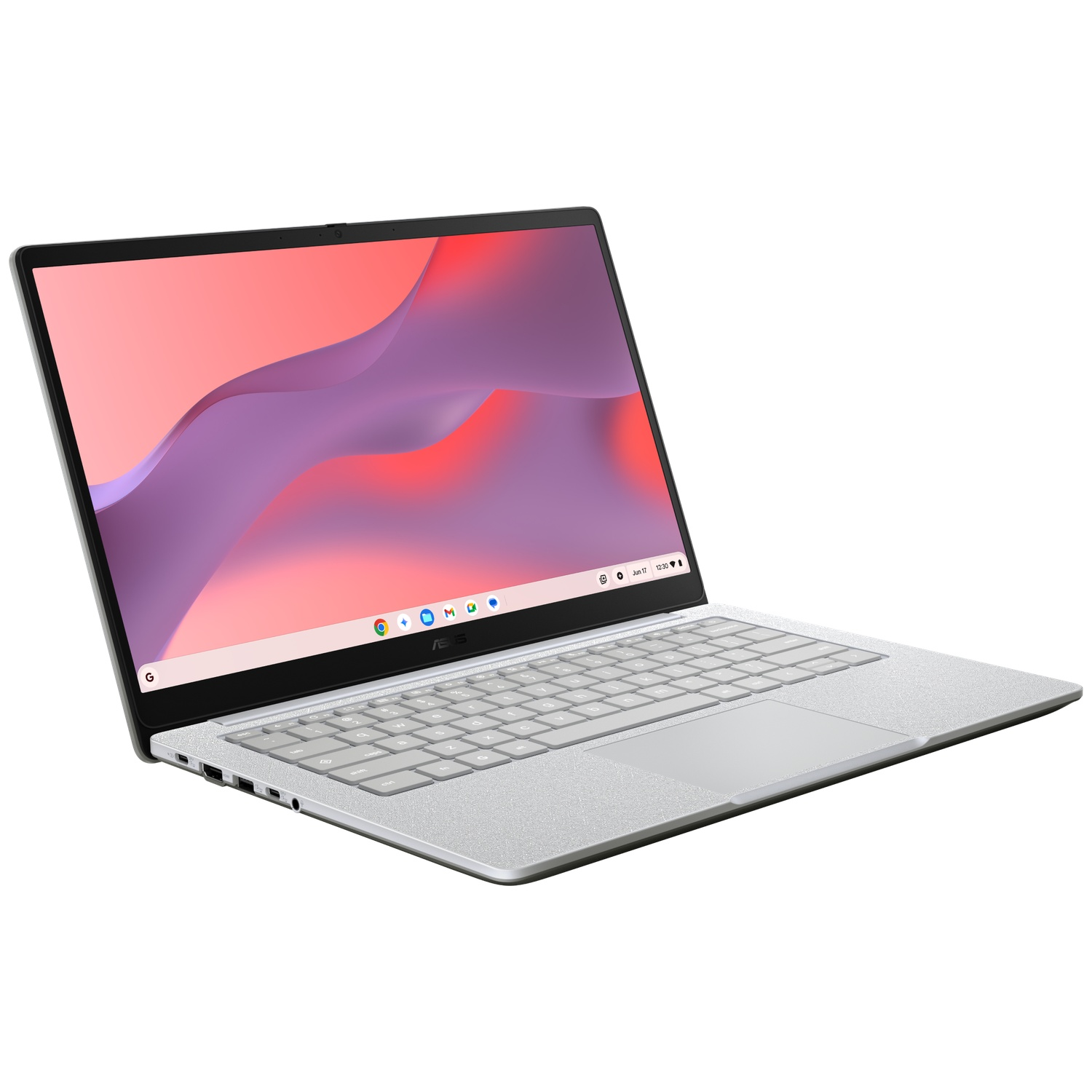 Un ordinateur portable argenté ouvert avec un fond d'écran abstrait et un clavier blanc, vu en biais.
