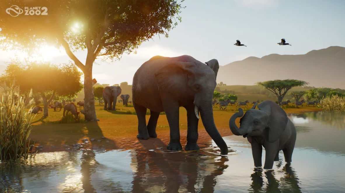 Elefanten an einem See in der afrikanischen Savanne bei Sonnenuntergang.