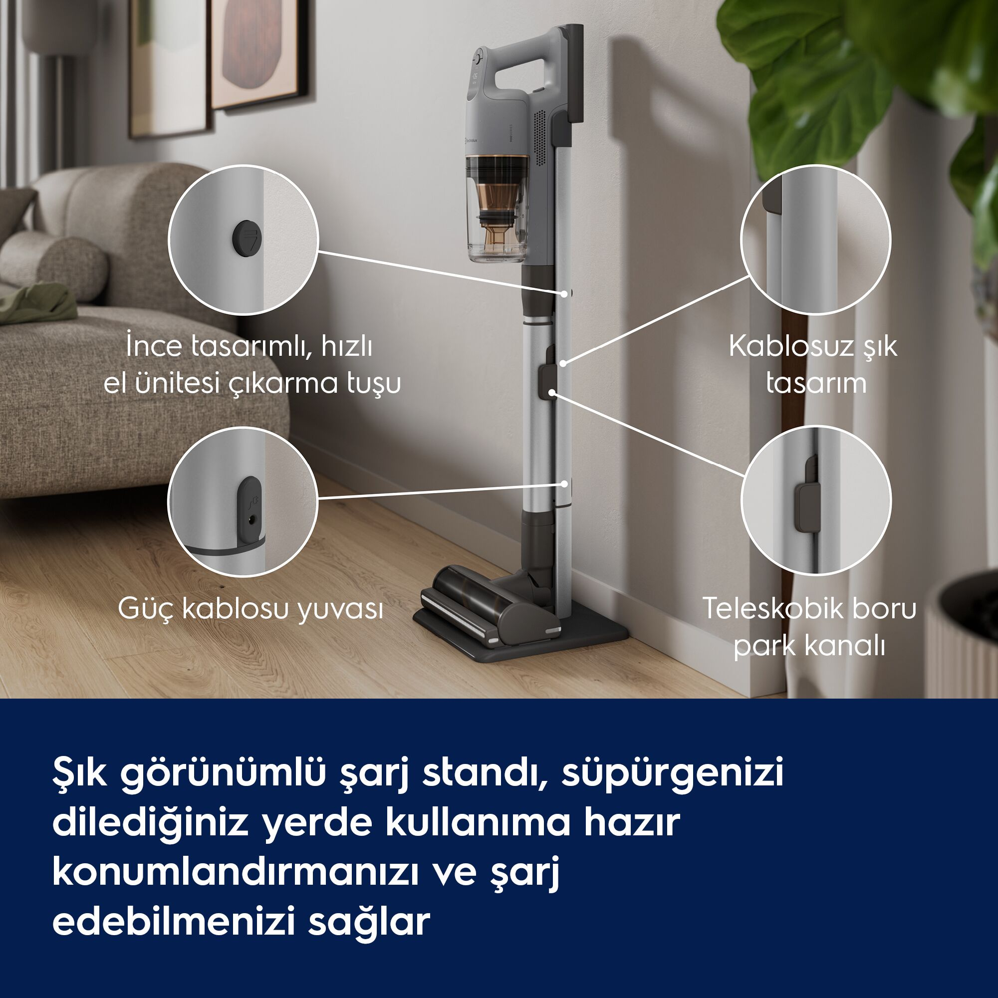 Şarj standında duran gri dikey süpürge ve detayları gösteren oklar.