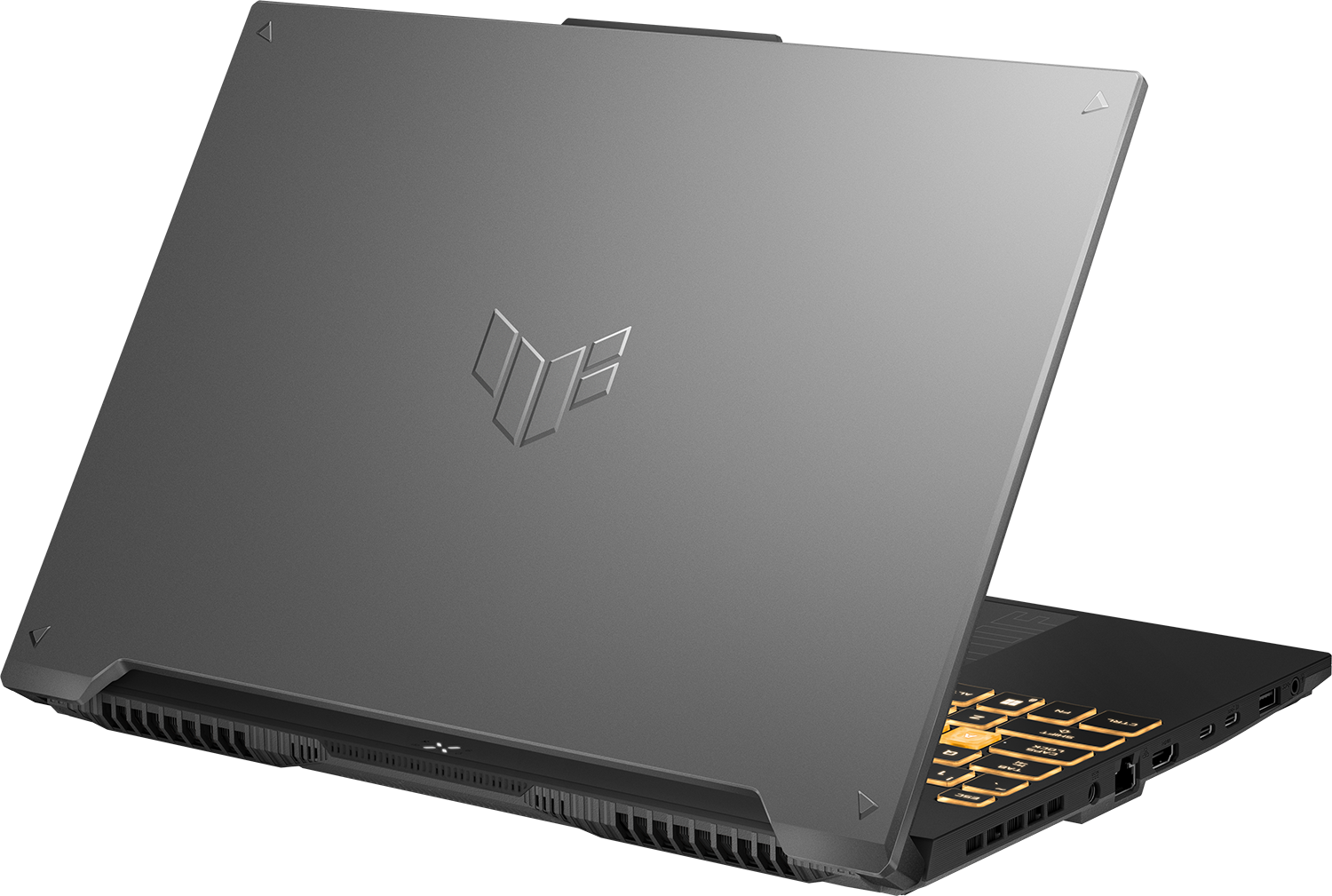 Egy szürke laptop zárt fedéllel, az ezüst márkajelzéssel és a háttérvilágítású billentyűzettel az oldalán.