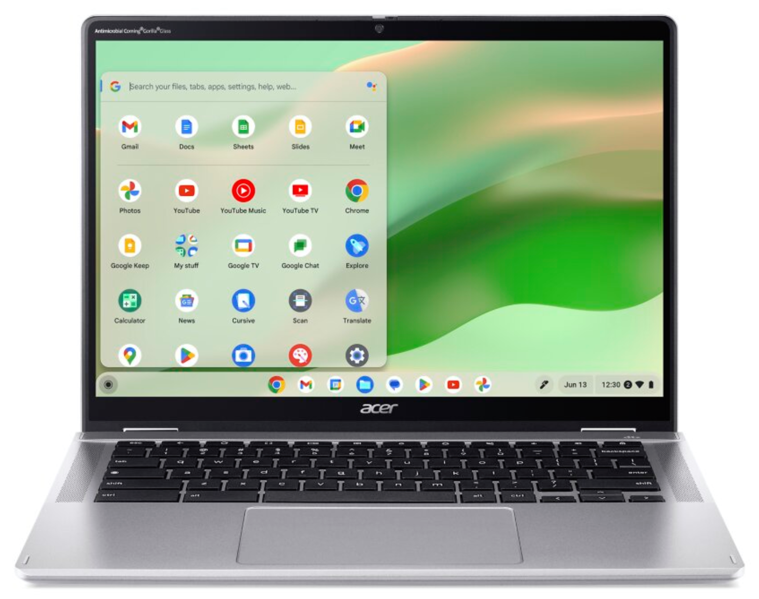 Un Chromebook de Acer muestra un menú de aplicaciones abierto en un fondo verde con teclado oscuro.